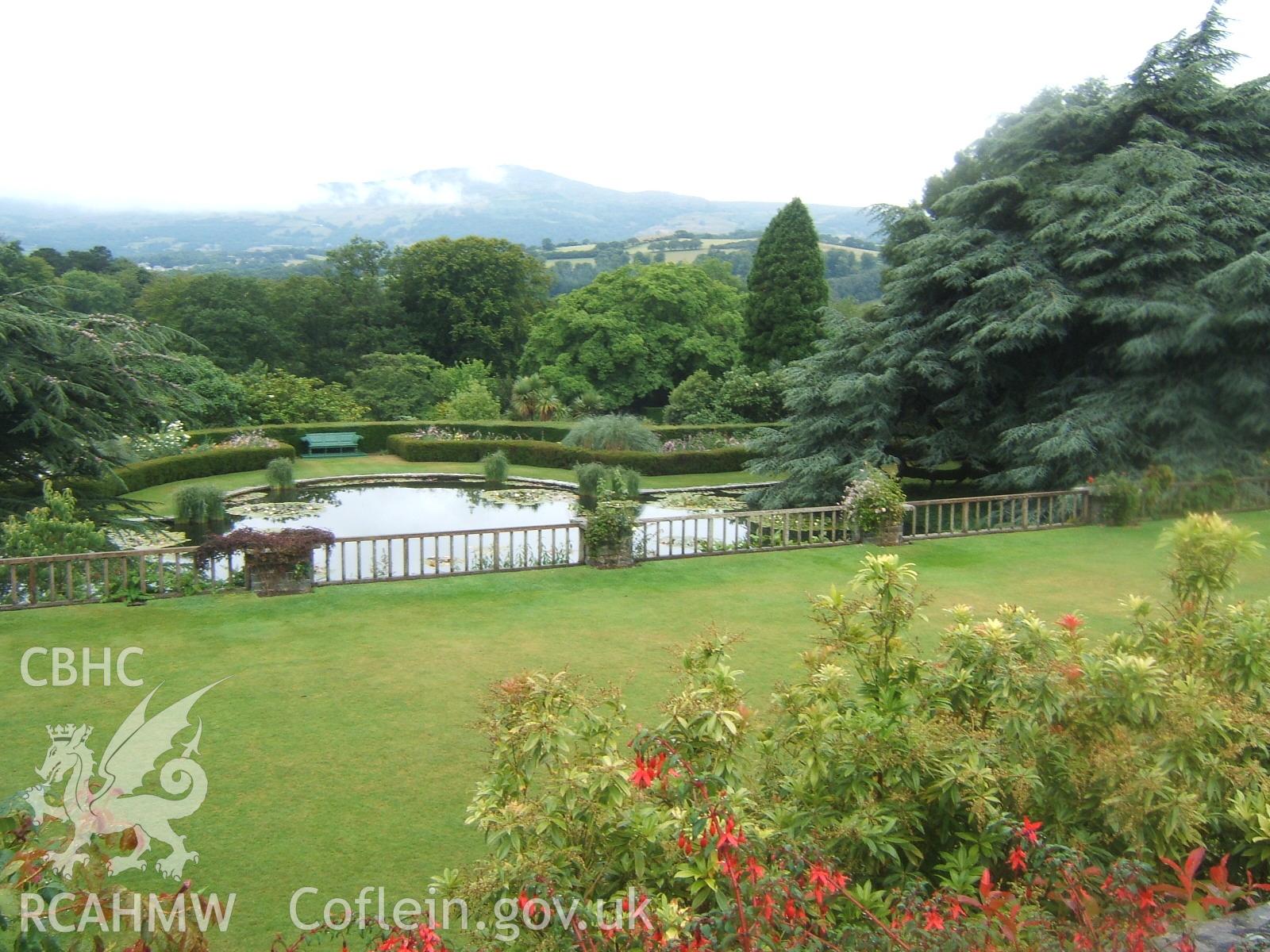 View from the Rose Terrace looking west over the Croquet Lawn and Lily Pond to the mountains beyond.