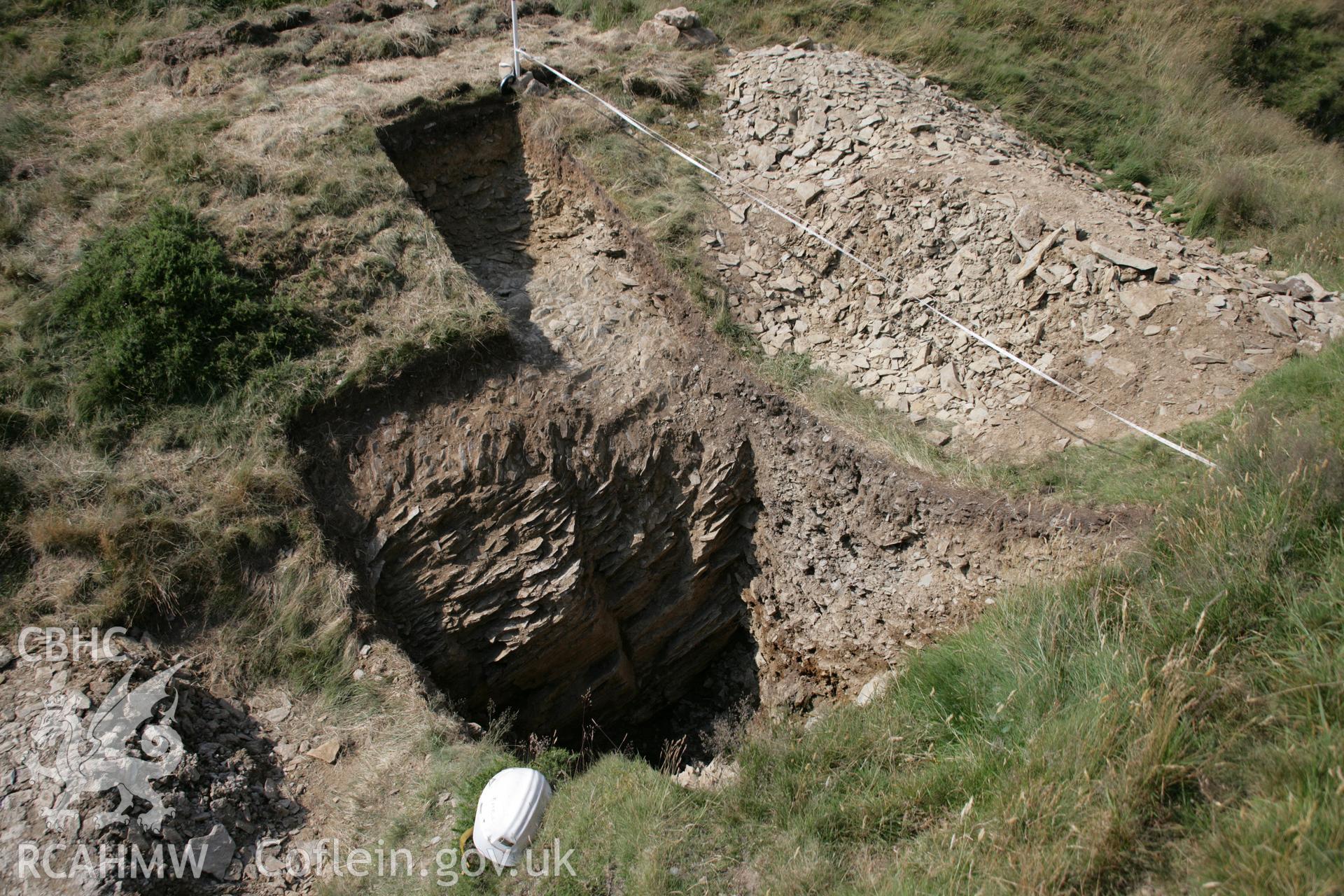 Darren, excavation of rock-cut ditch below northern outwork, viewed from south-east.