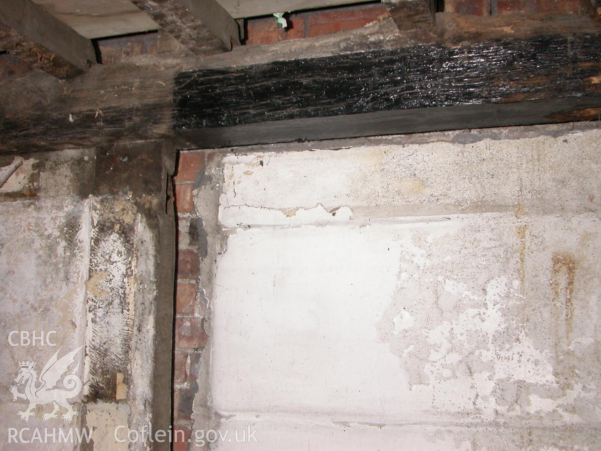 Interior of E wall showing former doorway lintel mortise.