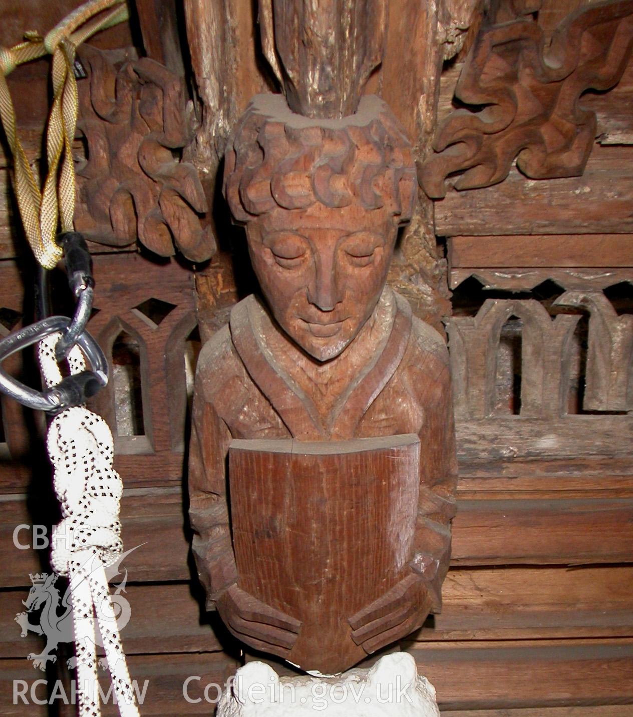 Carved wooden head between Trusses VI & VII, South side.