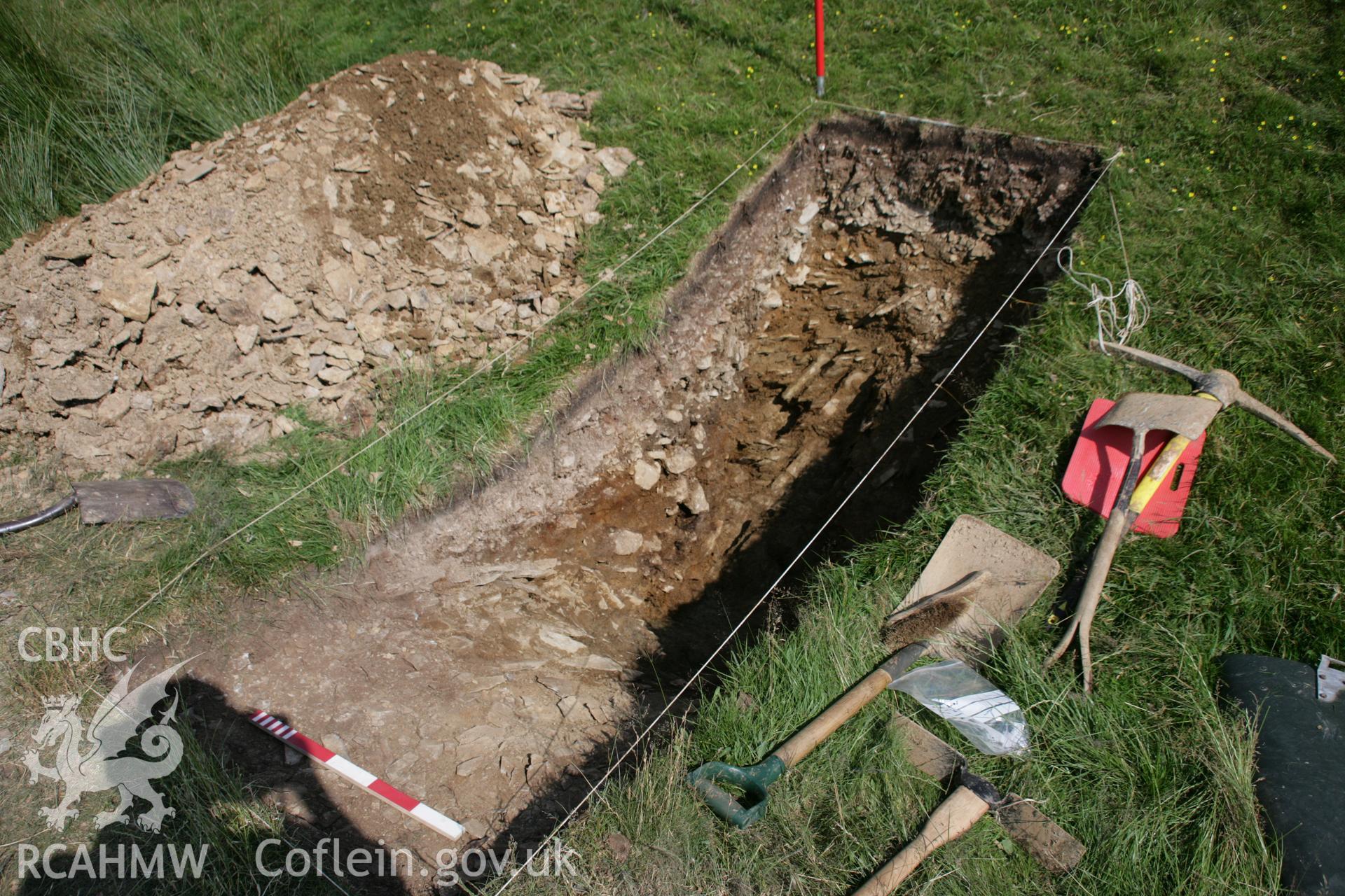 Darren; northernmost outer outwork; small excavation trench through mining spoil, viewed from west.