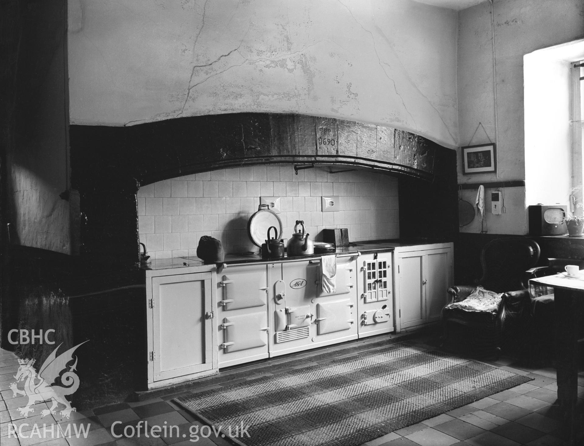 A very wide kitchen fireplace, situated in the right hand wing. It is inscribed 1690 and 1770.