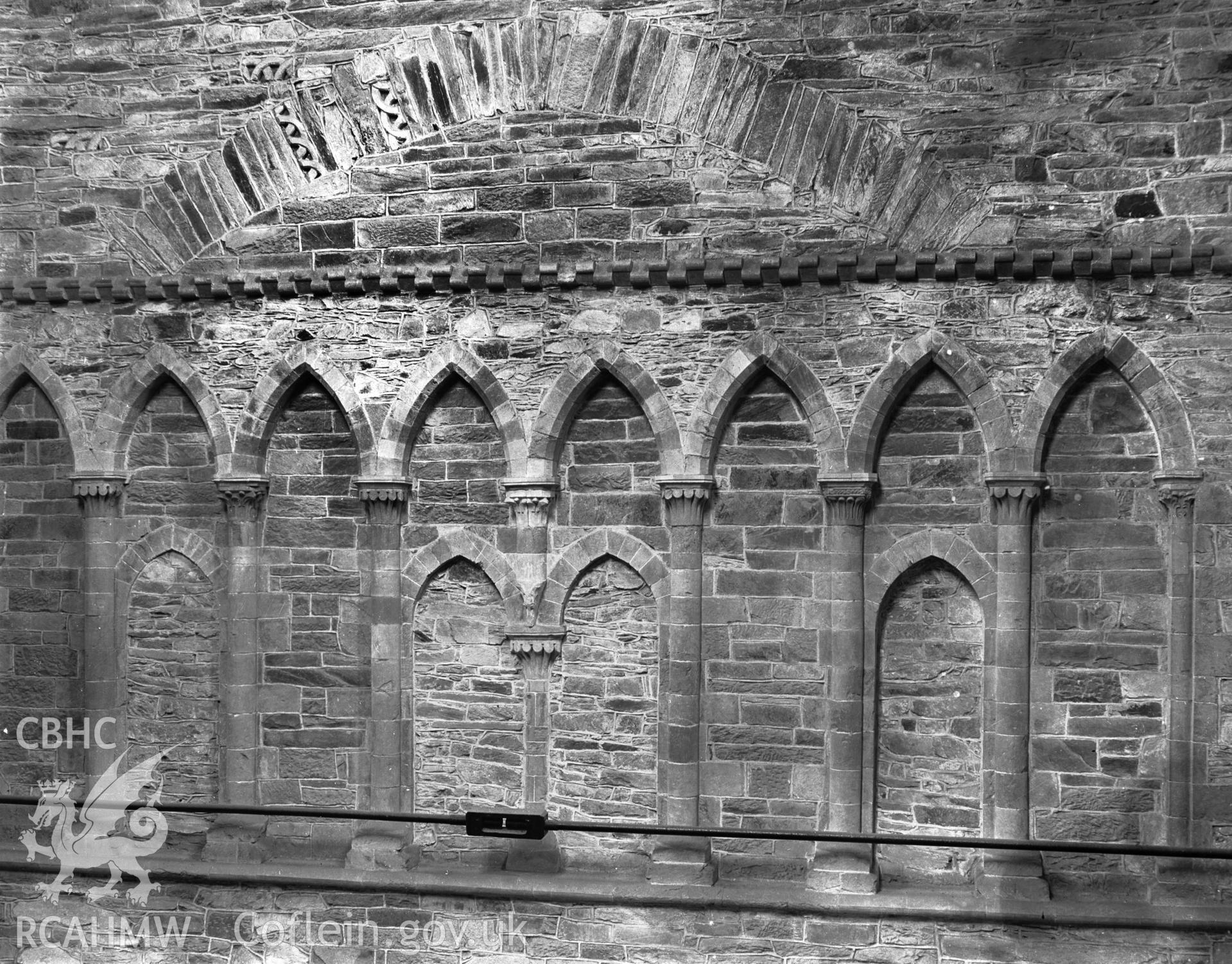 Interior view showing arcading on the west side of the tower, at triforium level.