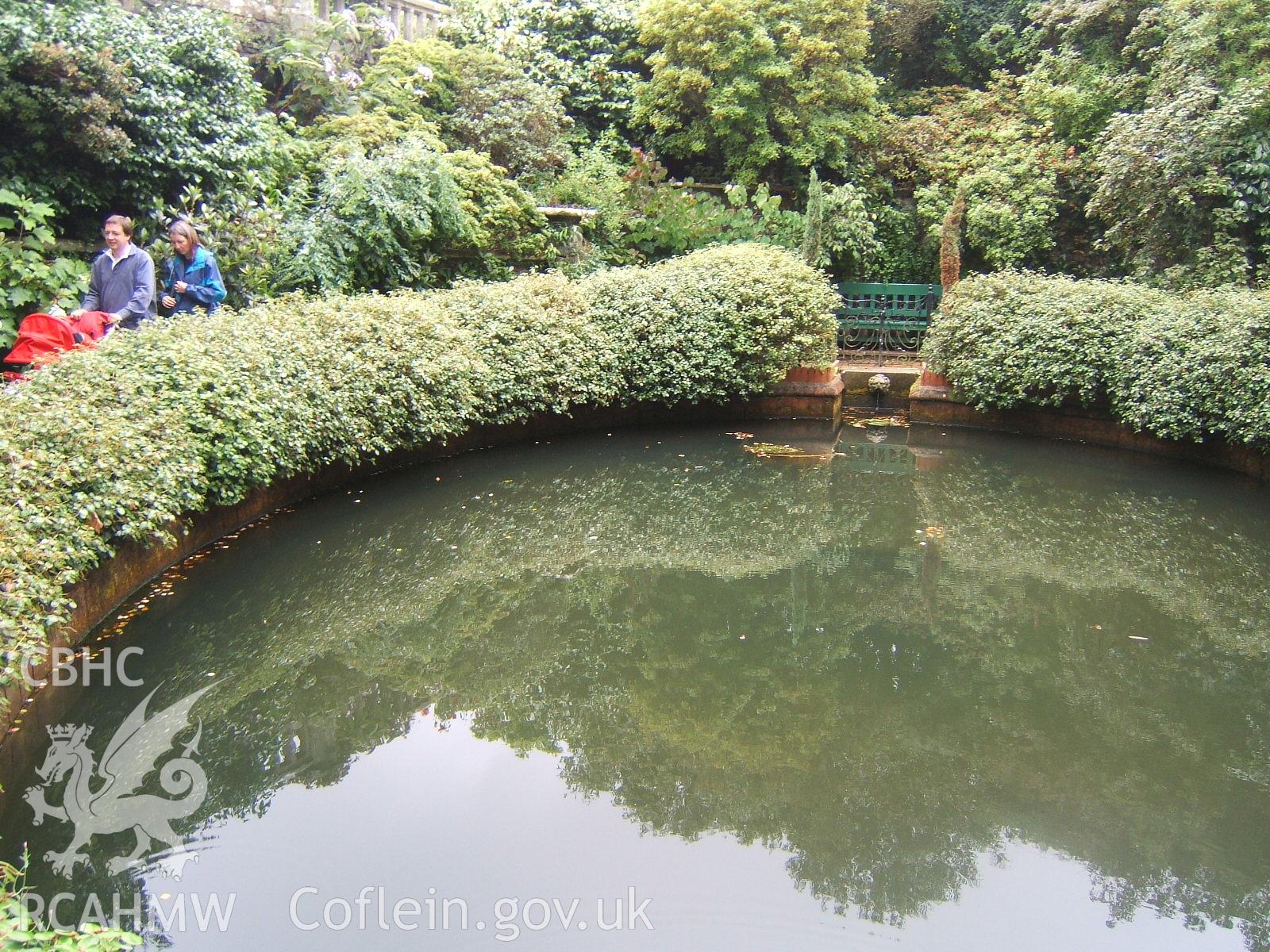 Deep round pond or swimming pool at head of stream in the Front Lawn, looking N.E.