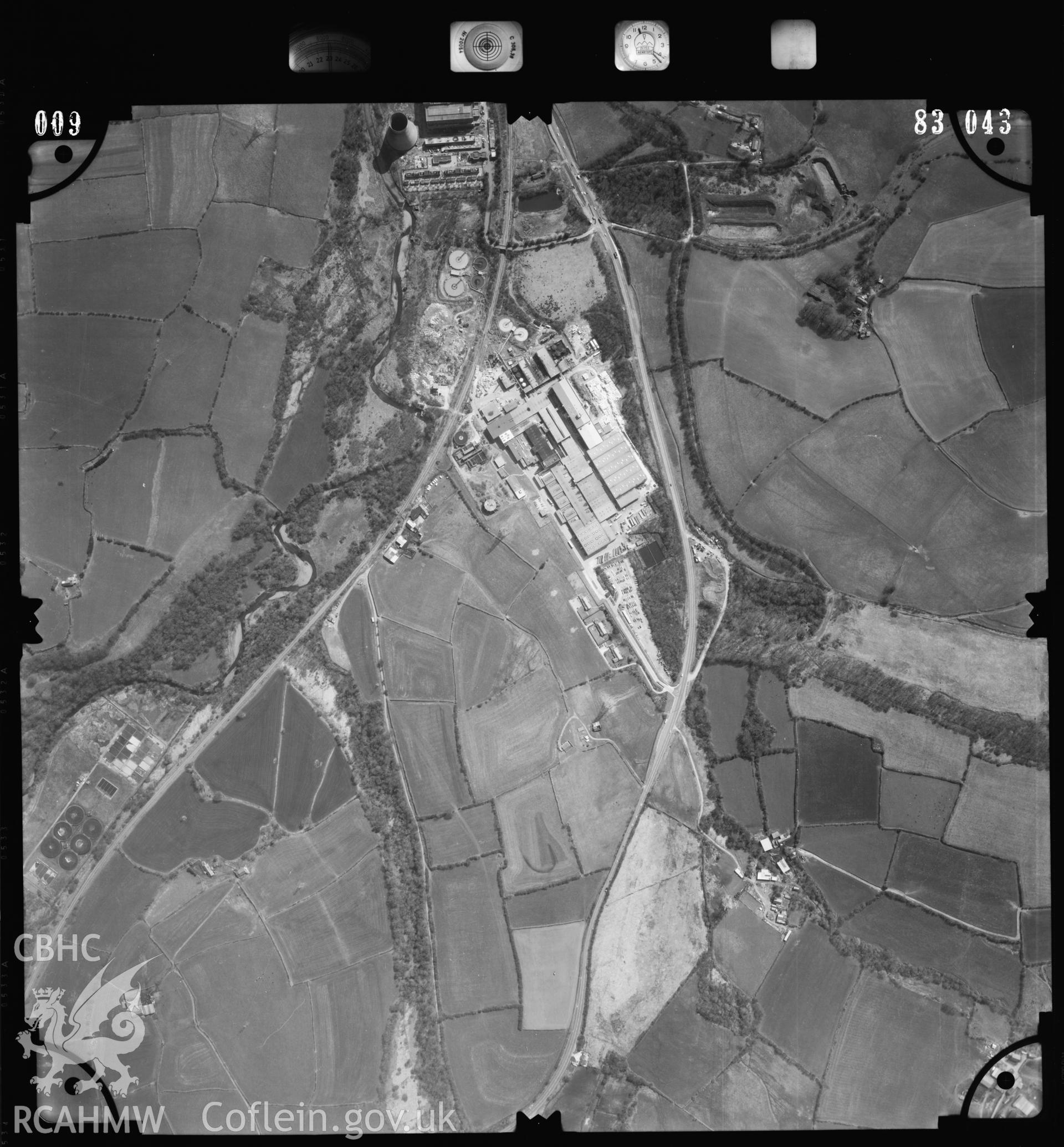 Digitized copy of an aerial photograph showing the area around Bridgend paper Mill, taken by Ordnance Survey, 1983.