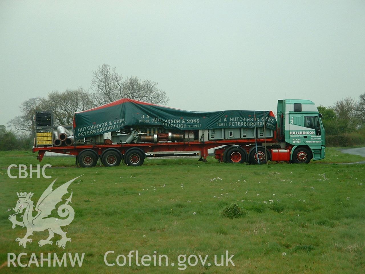 Colour digital photograph of engines being transported.