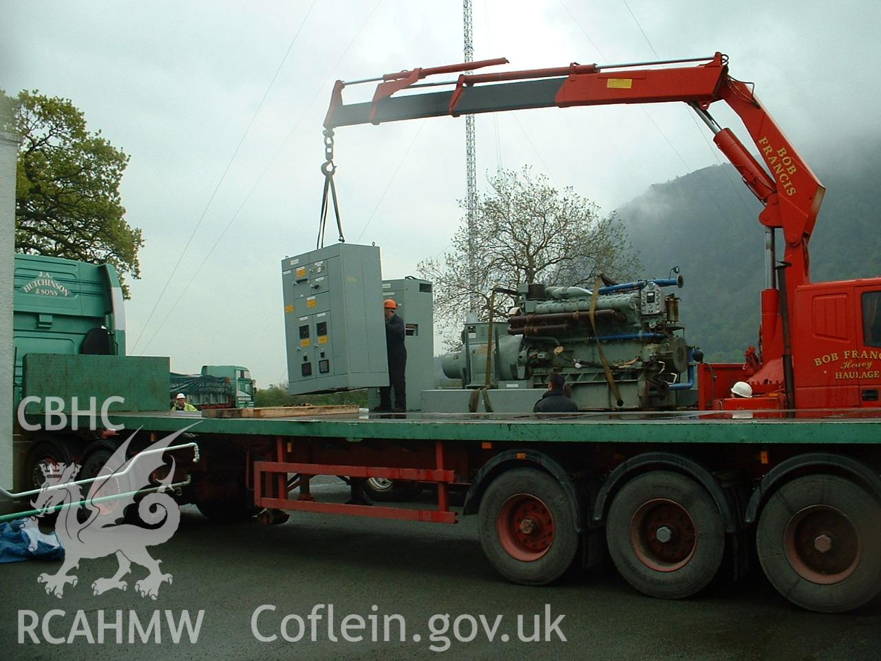 Colour digital photograph of engines being transported.