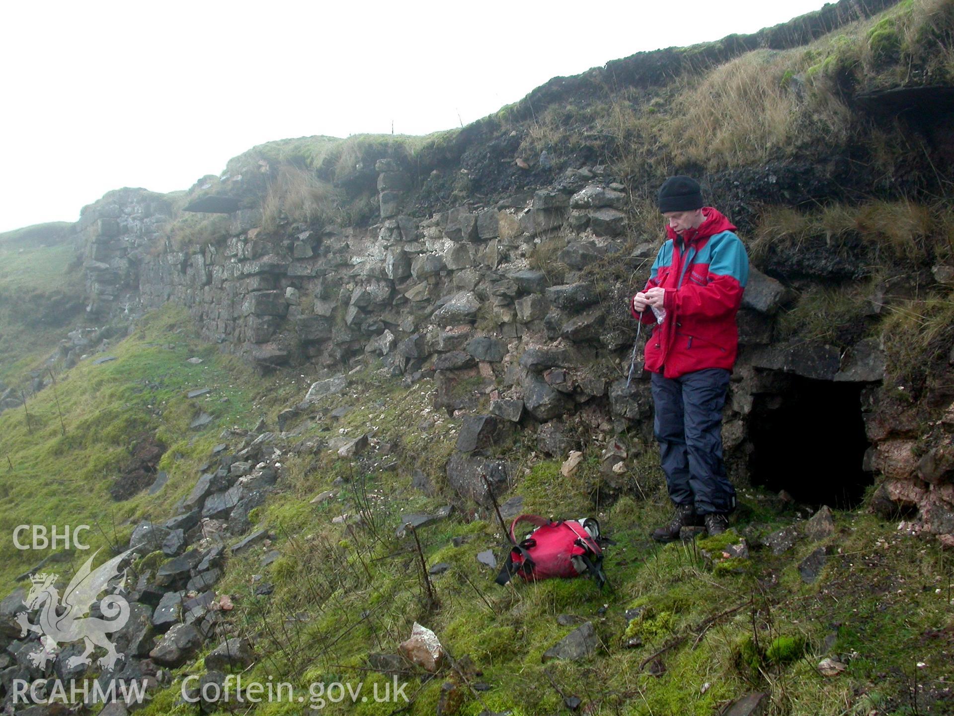 Student emerging from the hole in the north-west wall of the tunnel.