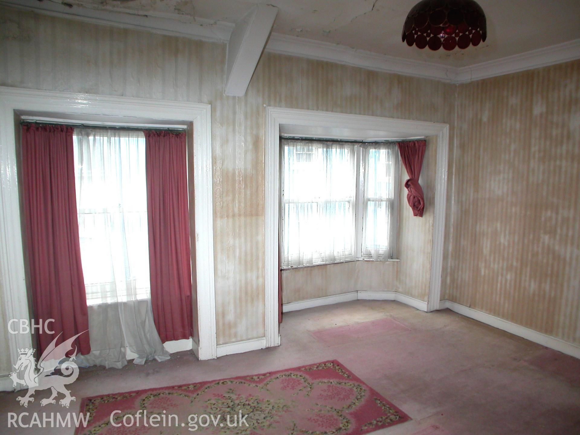 First floor room with bay and sah window on street frontage.