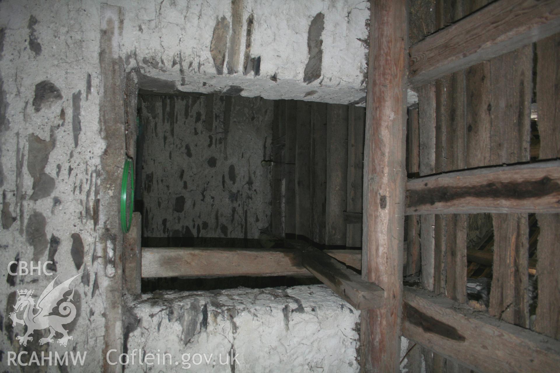 Interior, opening in stable/store cross-wall for belt-drive.