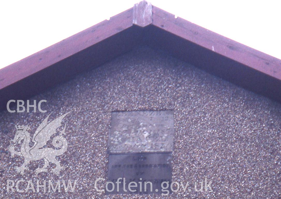 Exterior, plaques in SW. gable elevation.
