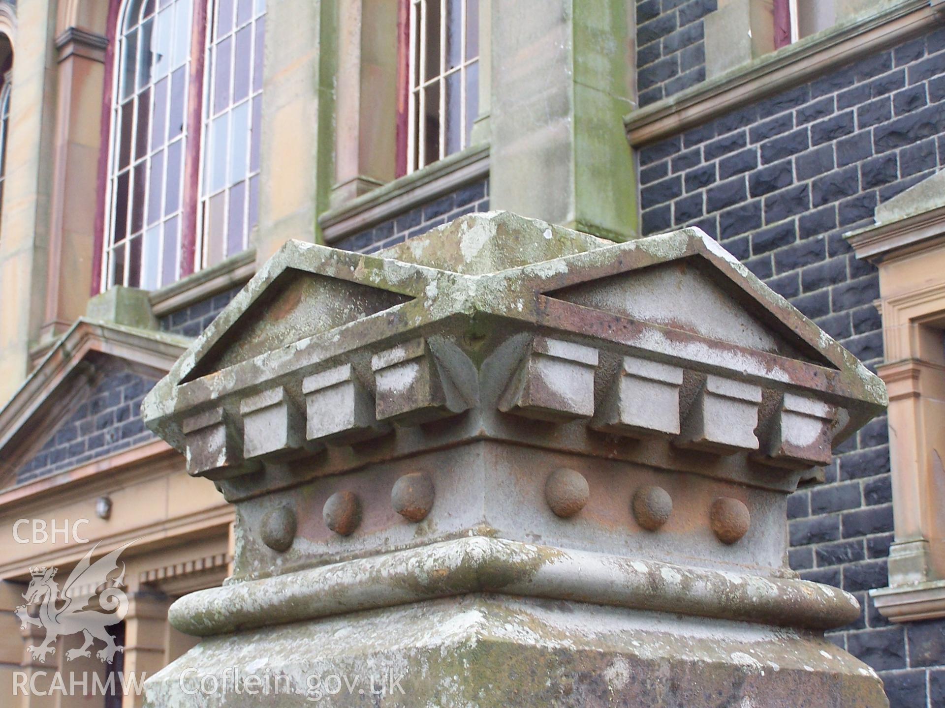 Chapel: Exterior - capstone on top of gate pillar.