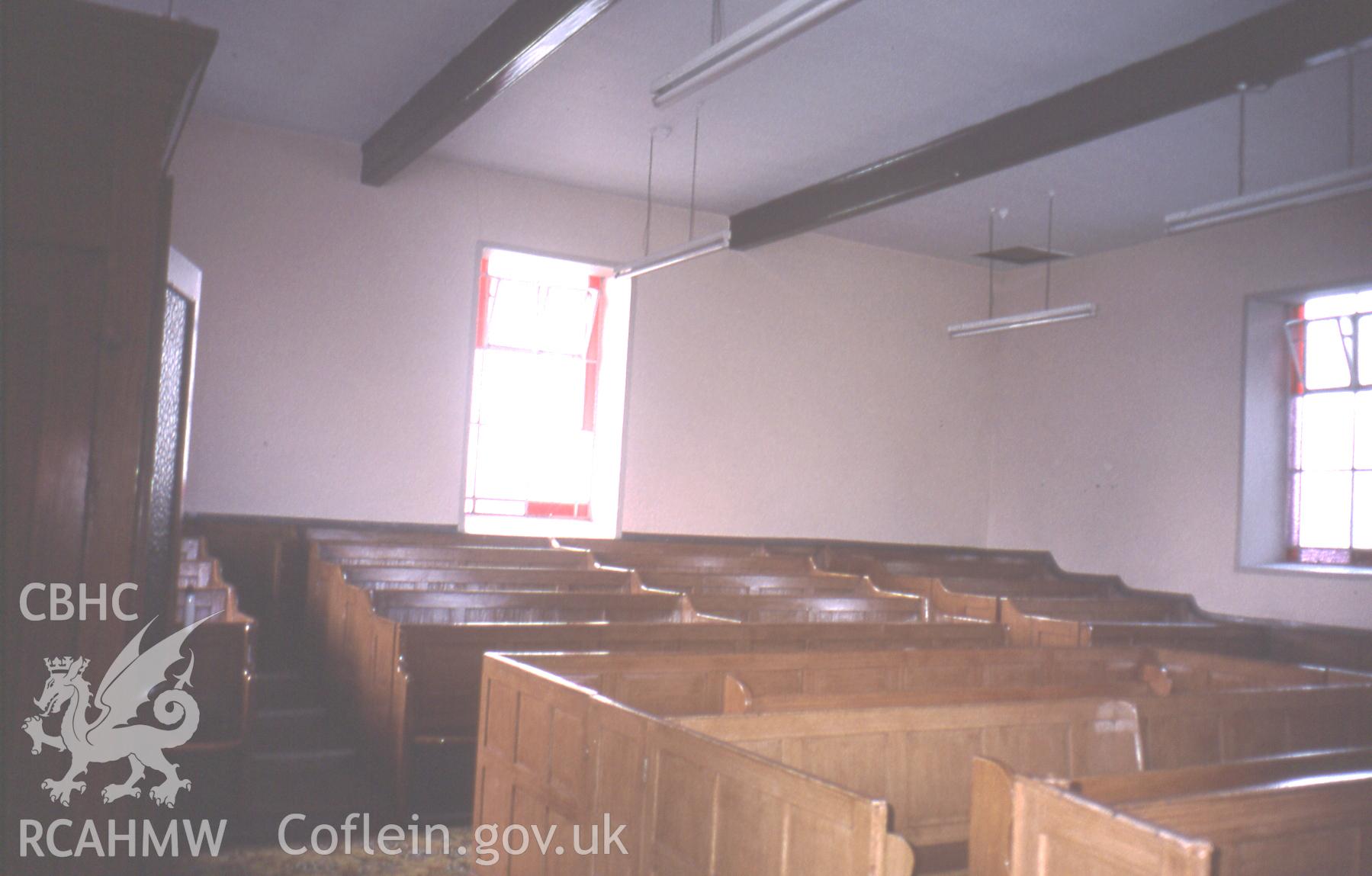 Interior, box pews looking to rear.