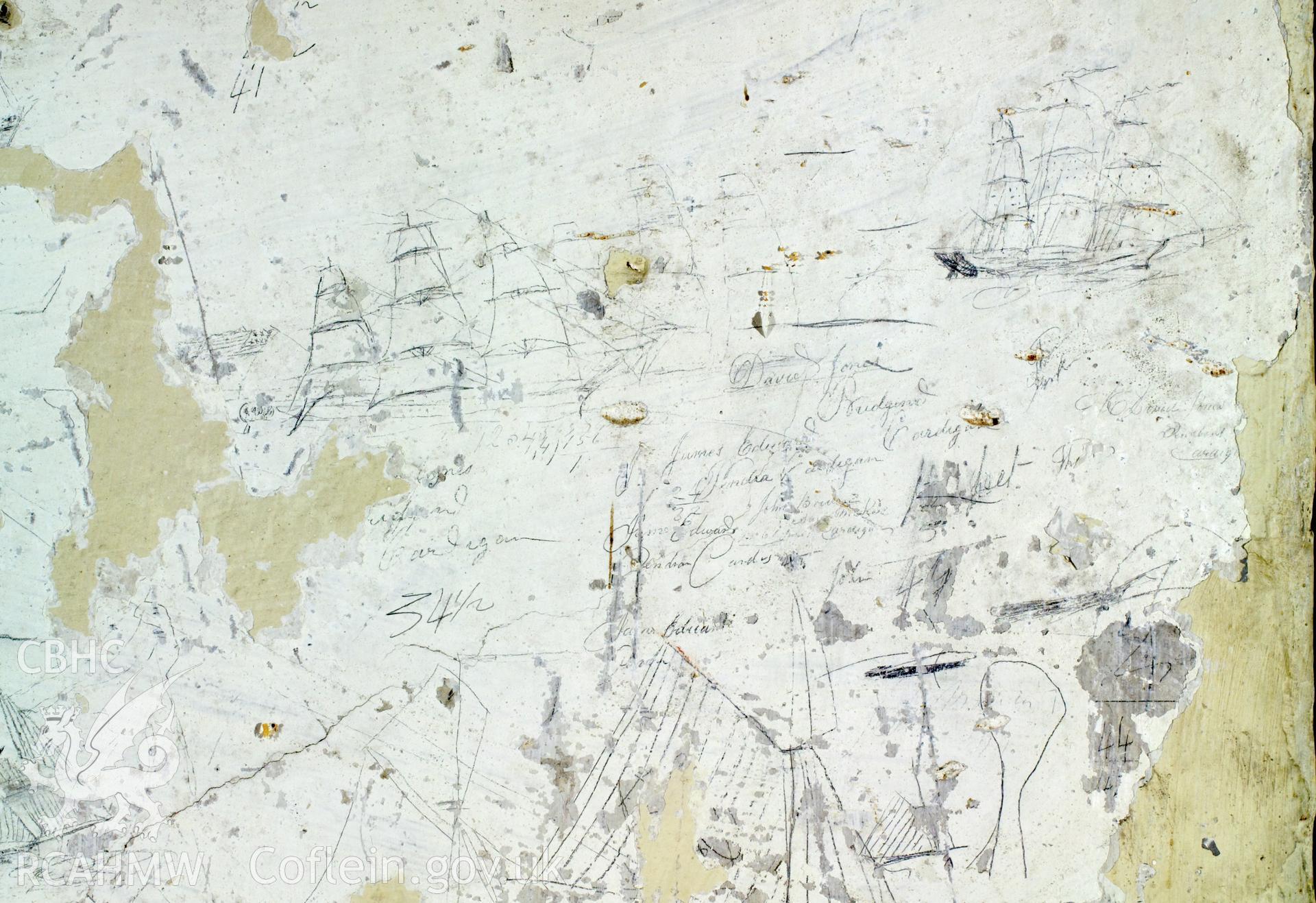 South wall, lefthand panel. Detail of graffitti.