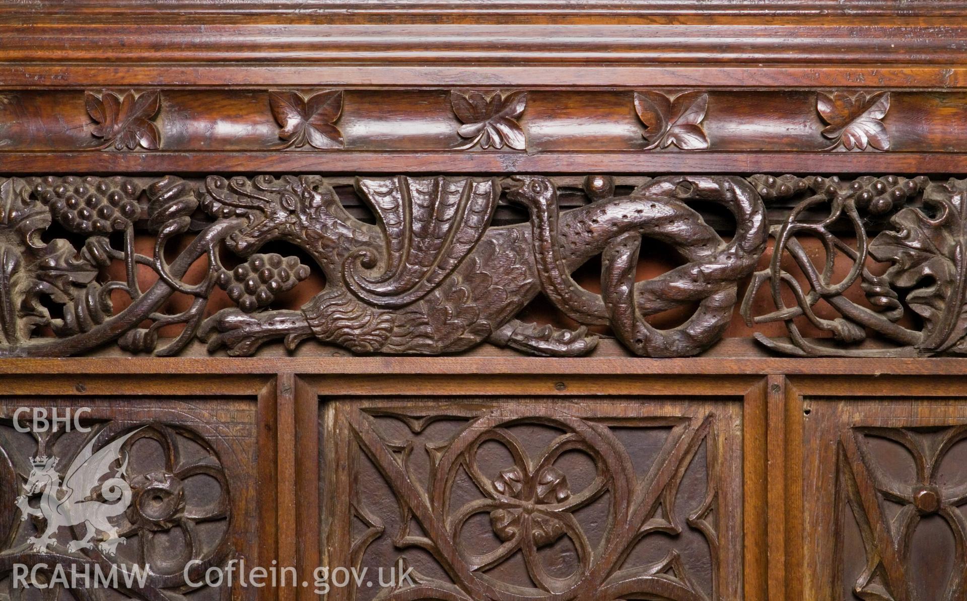 Mediaeval carving of dragon with serpents tail.