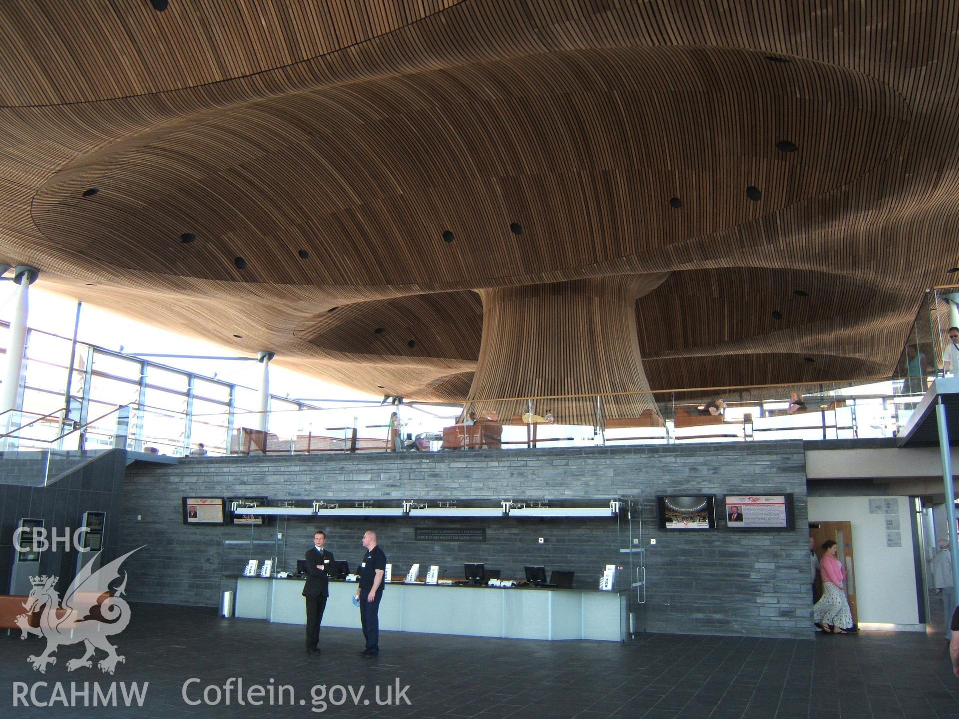 Interior of the Senedd Building looking NE from the portico with figure emerging from public gallery.