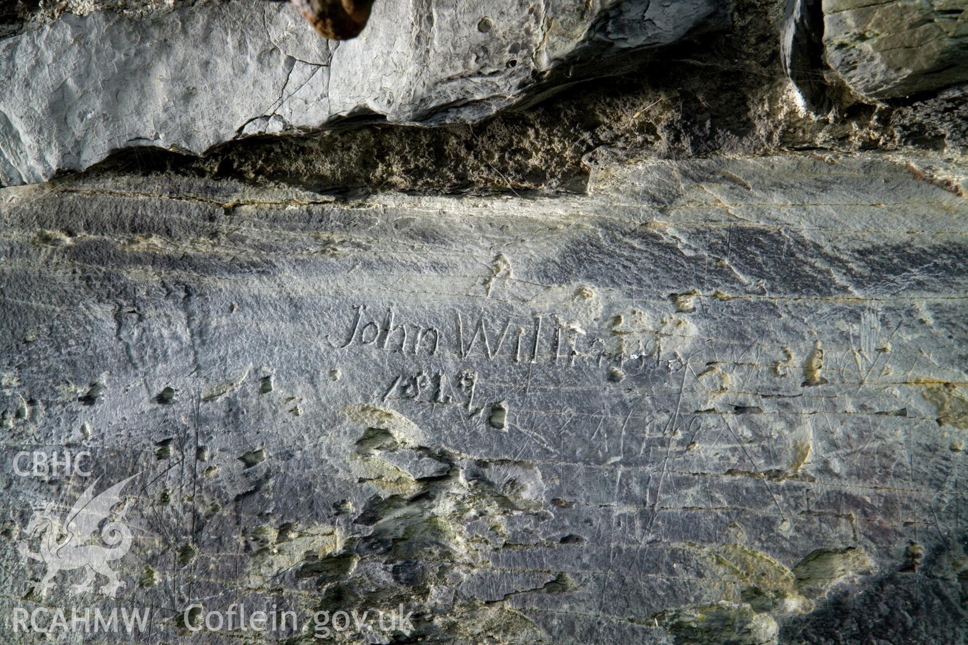 "John Williams 1819" inscription on stone on east side.