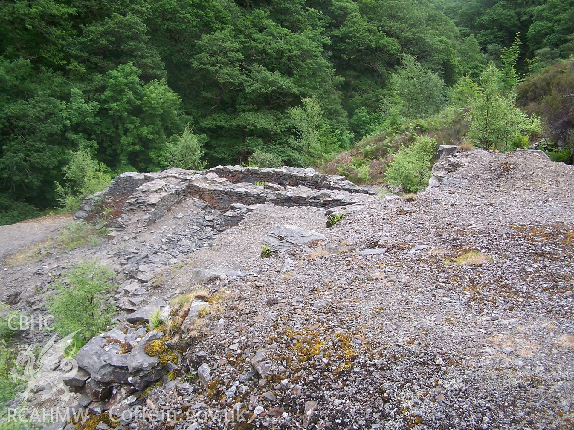 View of crusher house and wheelpit of 30ft. wheel, from top of ore bins, looking SE.