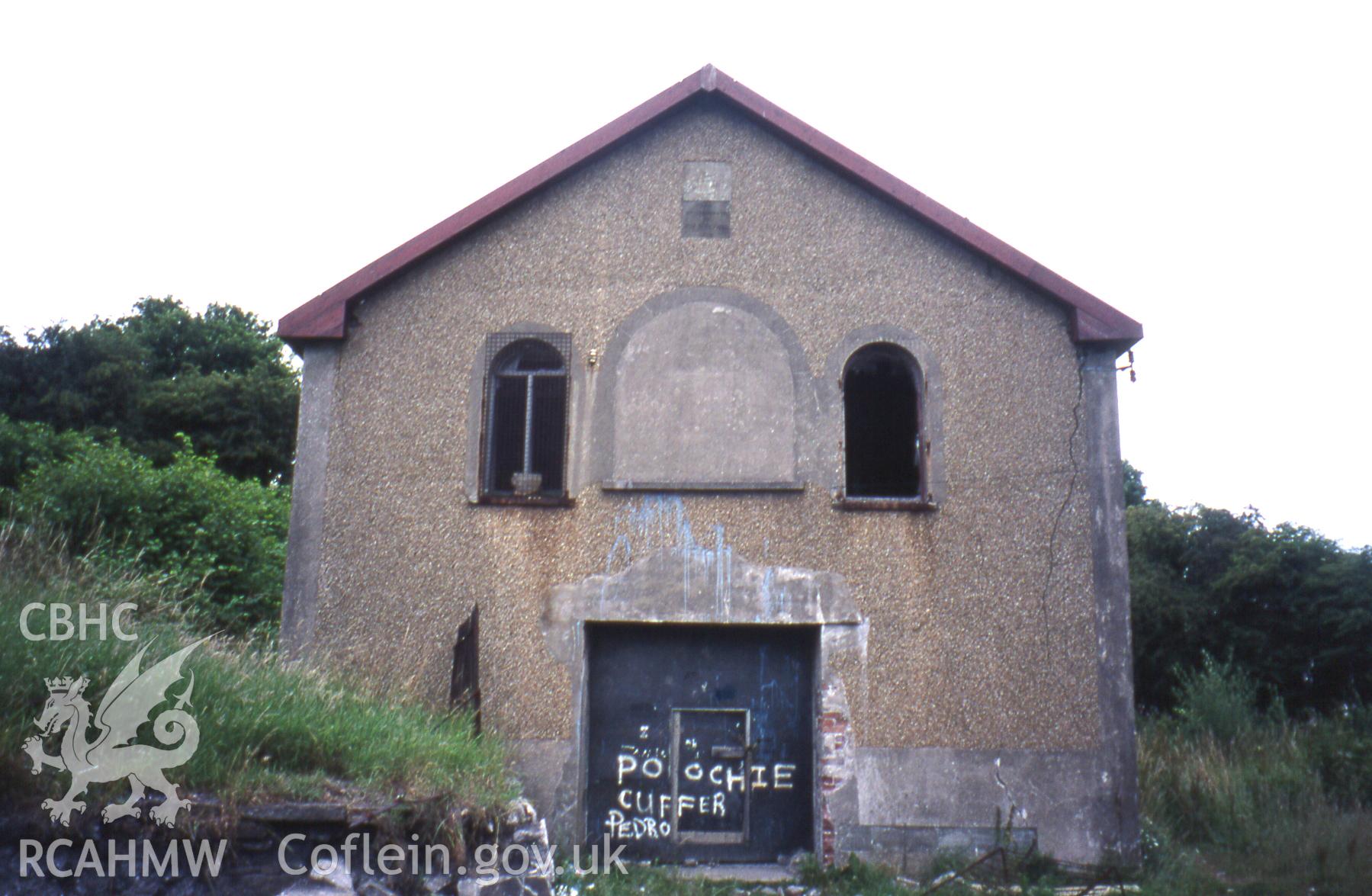 Exterior, main SW. gable-end elevation.