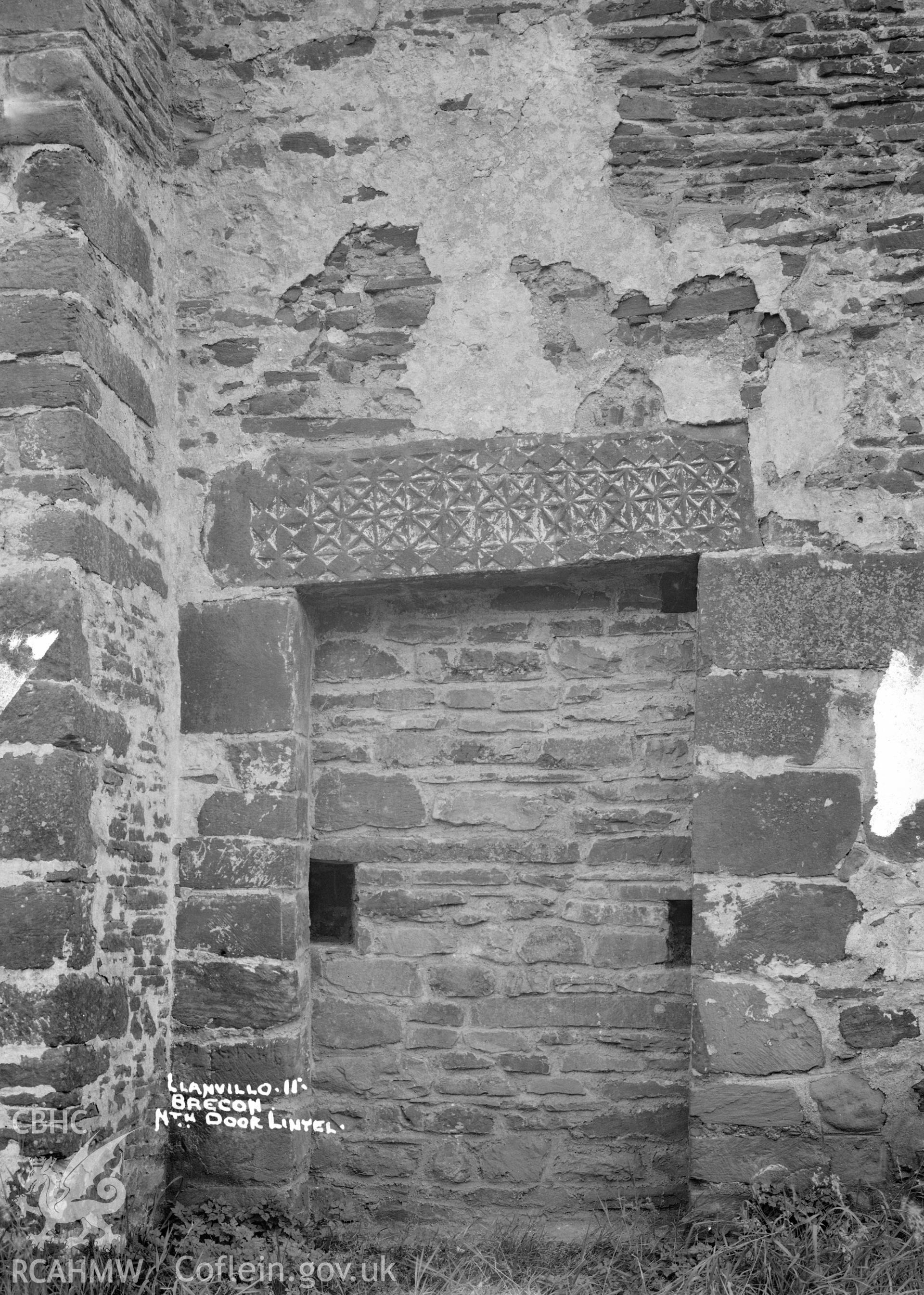 View of Llanfilo Church showing north door lintel, taken by W A Call 1931.