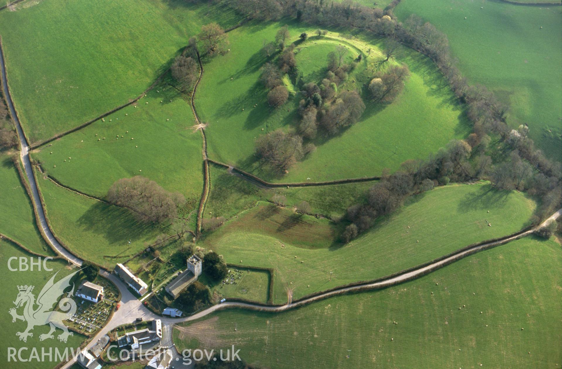Slide of RCAHMW colour oblique aerial photograph of Crickadarn Castle earthworks., taken by C.R. Musson, 13/4/1995.