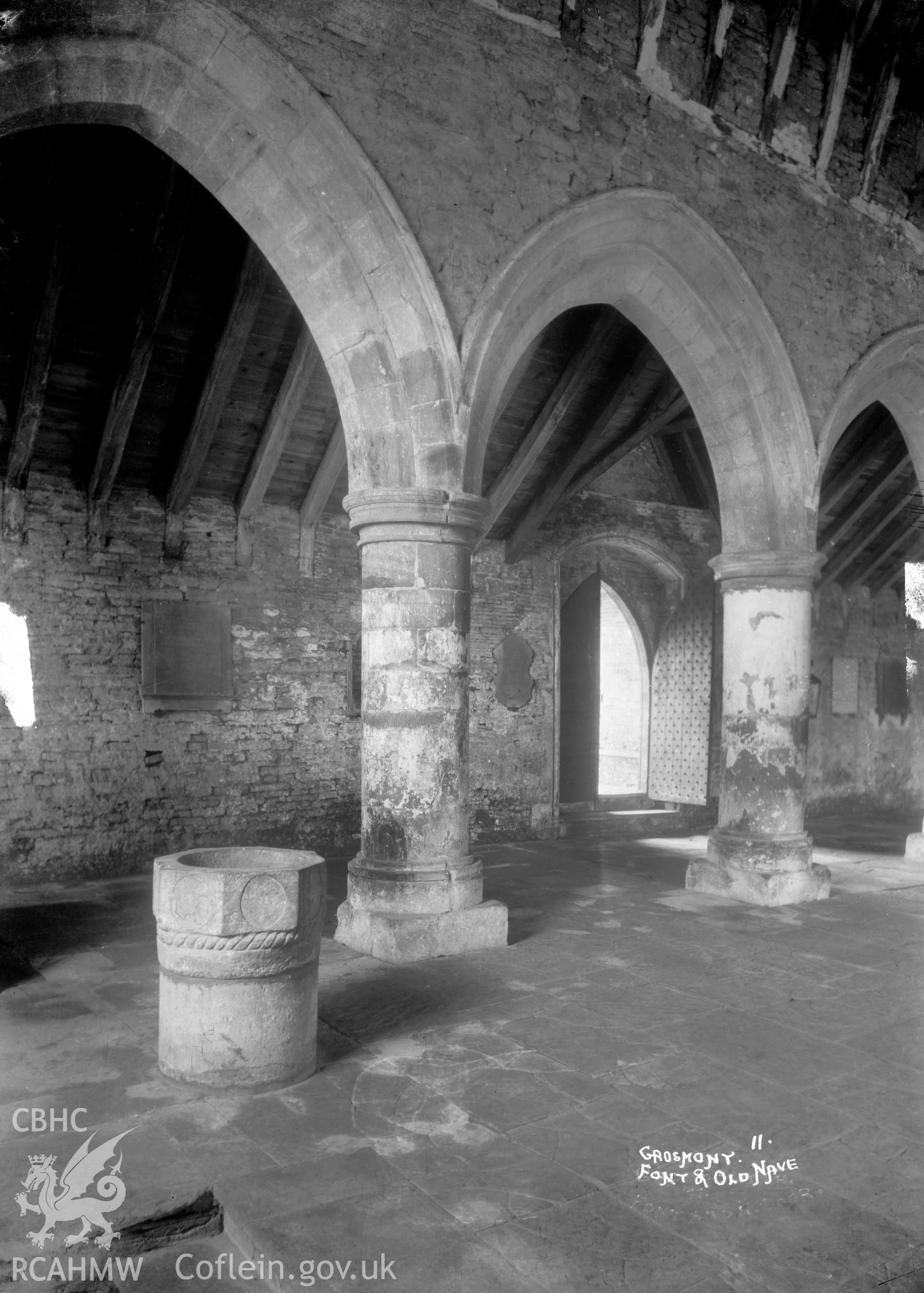 Interior view of Grosmont Church showing the font and the old nave, taken by W A Call pre-1950.