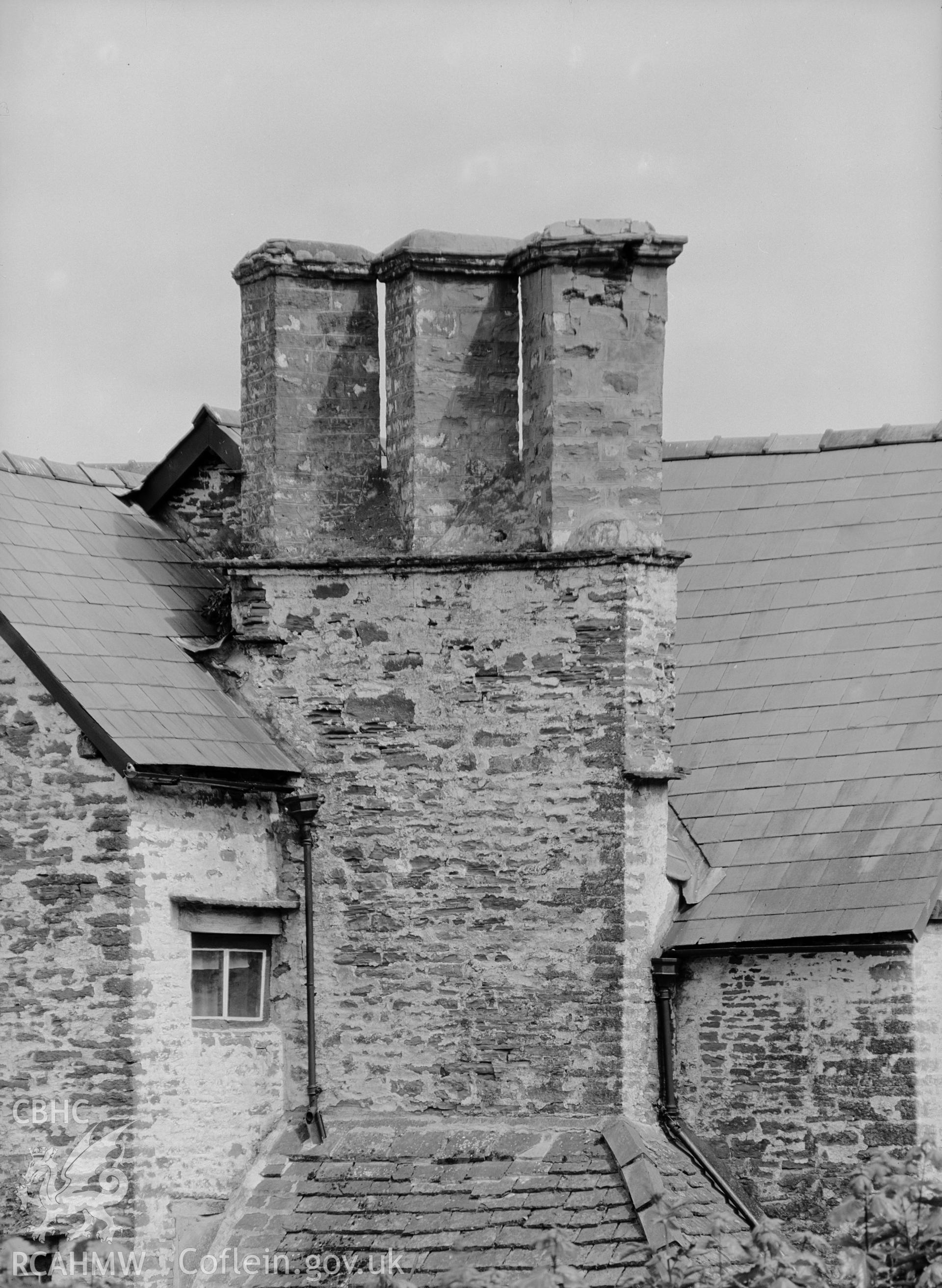 Exterior view of farmhouse from west showing close-up of chimney