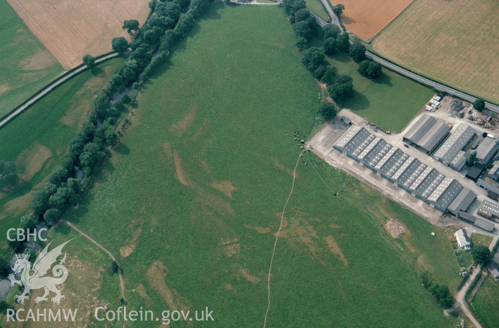 RCAHMW colour slide oblique aerial photograph of cropmarks at Cefn Rug, Clynwyd, taken by C.R.Musson on the 22/07/1996