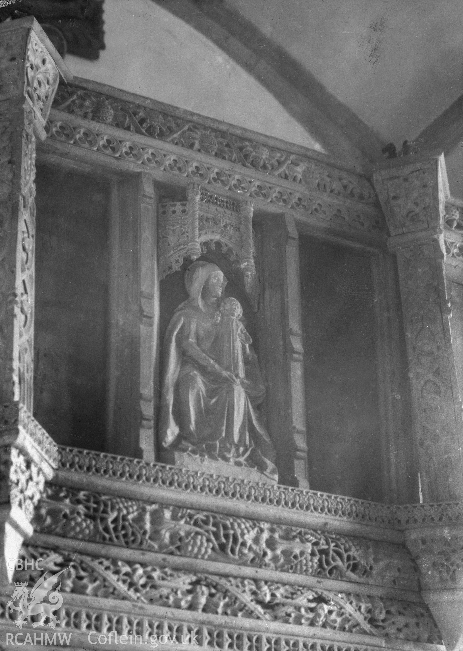 View of the Madonna and child statue above the screen in Llanfilo Church, Brecon. taken by W A Call circa 1920.