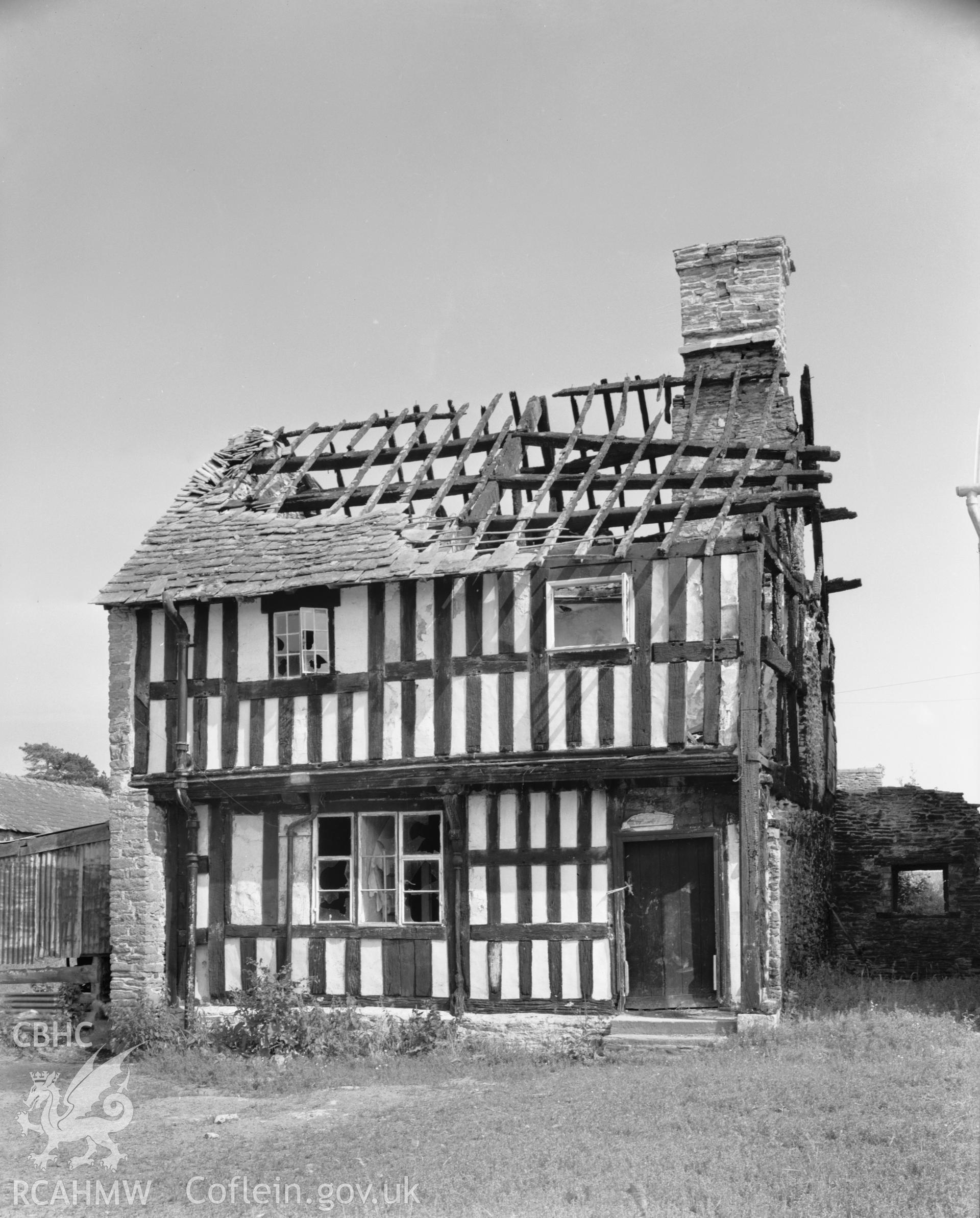 Exterior, showing fire damage.