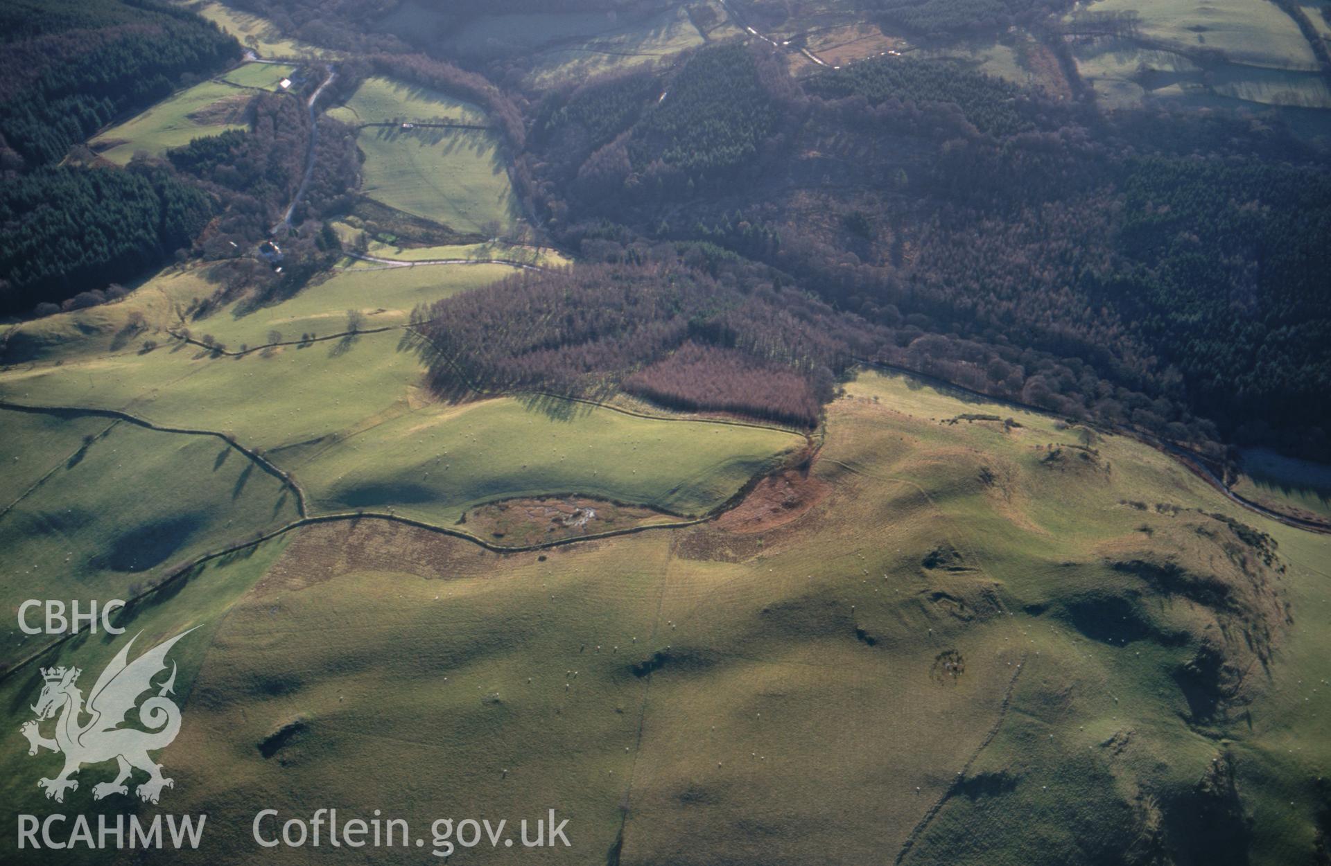 RCAHMW colour slide oblique aerial photograph of an enclosure with ridge and furrow south-west of Strata Florida, Ystrad Fflur, taken on 04/12/1998 by Toby Driver