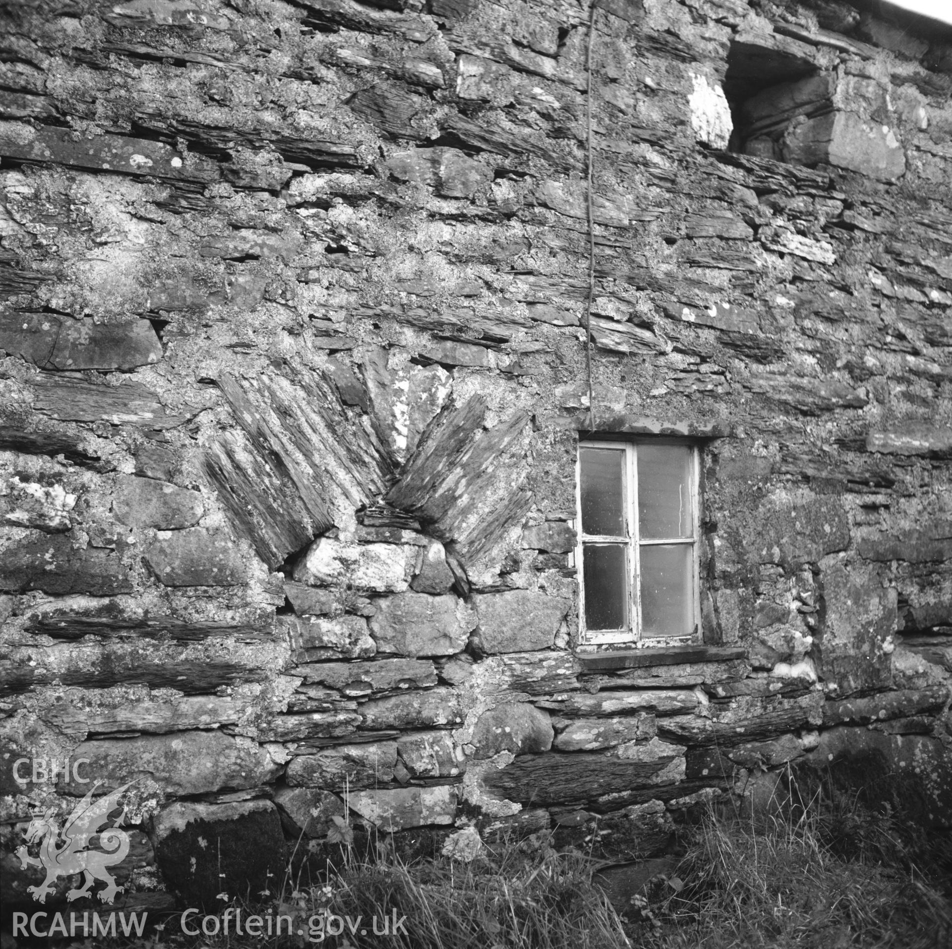 Exterior view of farmhouse showing blocked doorway