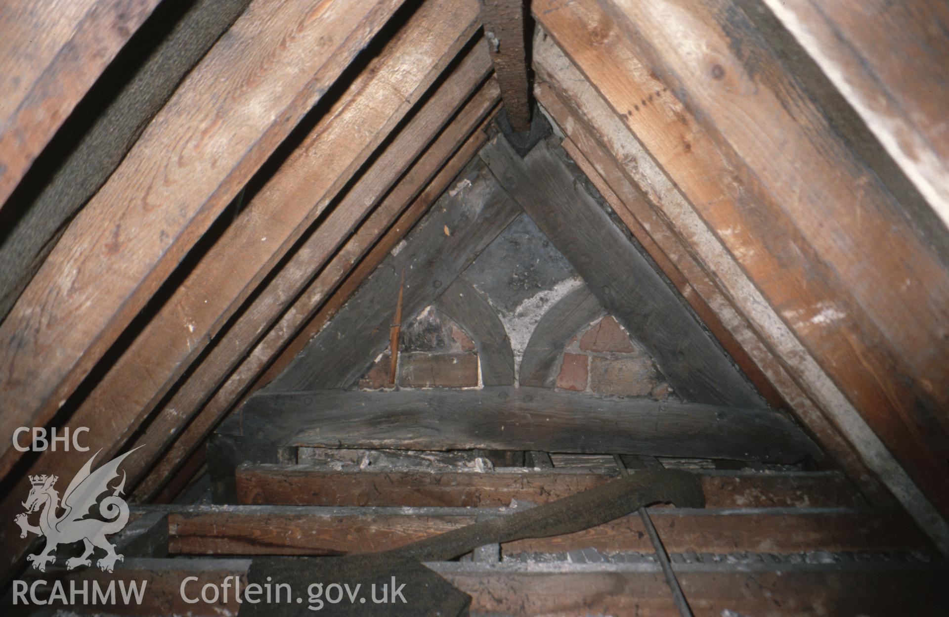 Interior view showing decorative framing to the original dormer gable window on east end.