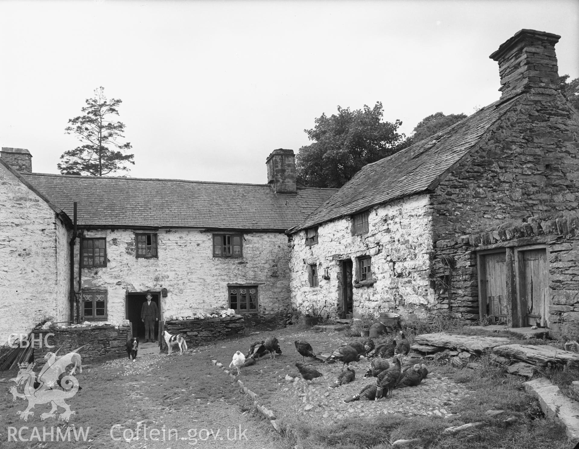 Exterior view showing the farmhouse from the east with the old house on the right.