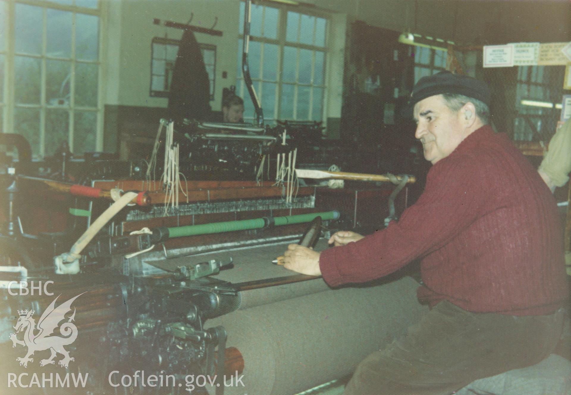 Interior view showing the weaving process at Cambrian Wool Factory.