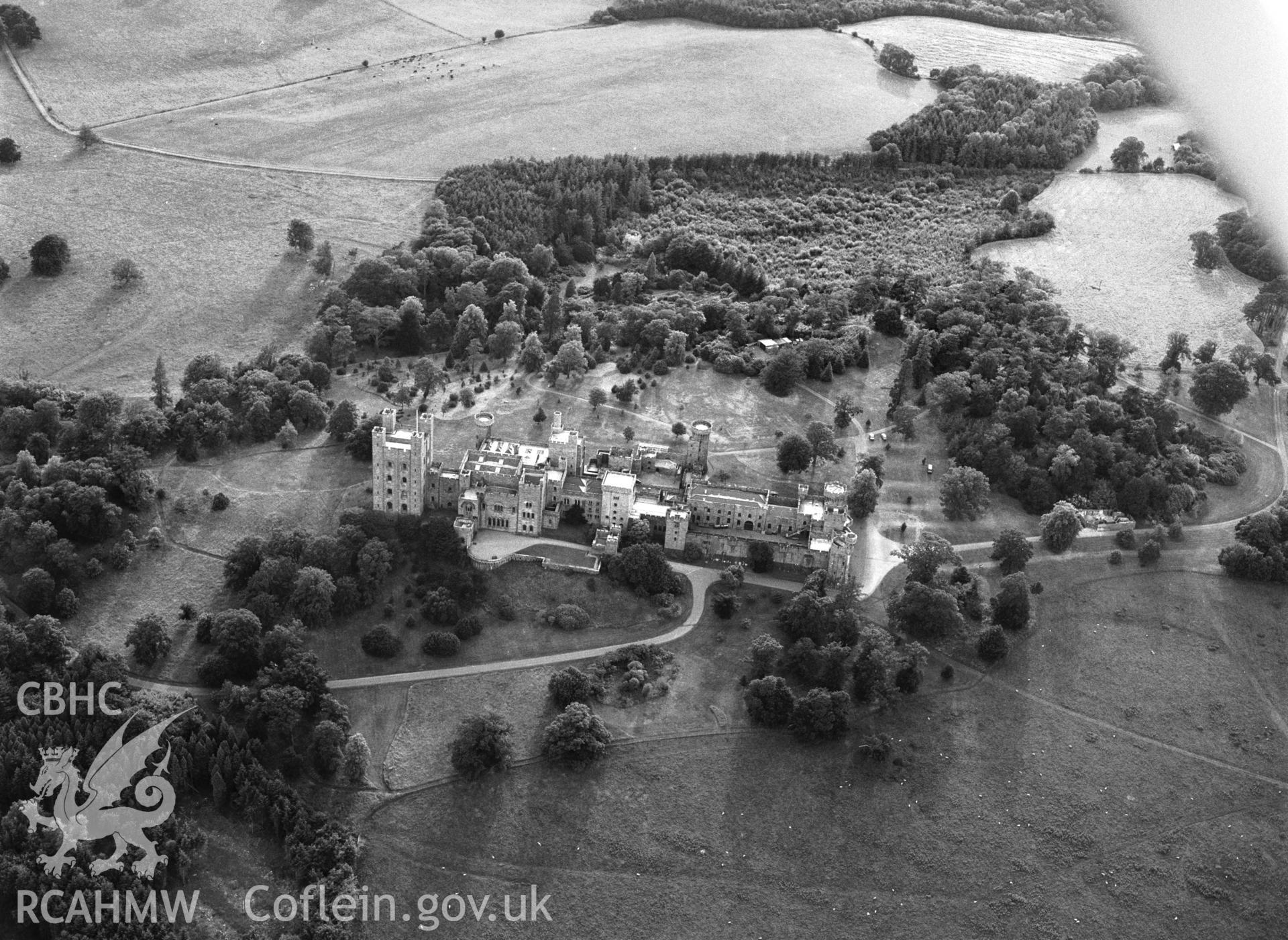 RCAHMW black and white oblique aerial photograph of Penrhyn Castle, Bangor, taken by C R Musson, 27/07/1996.