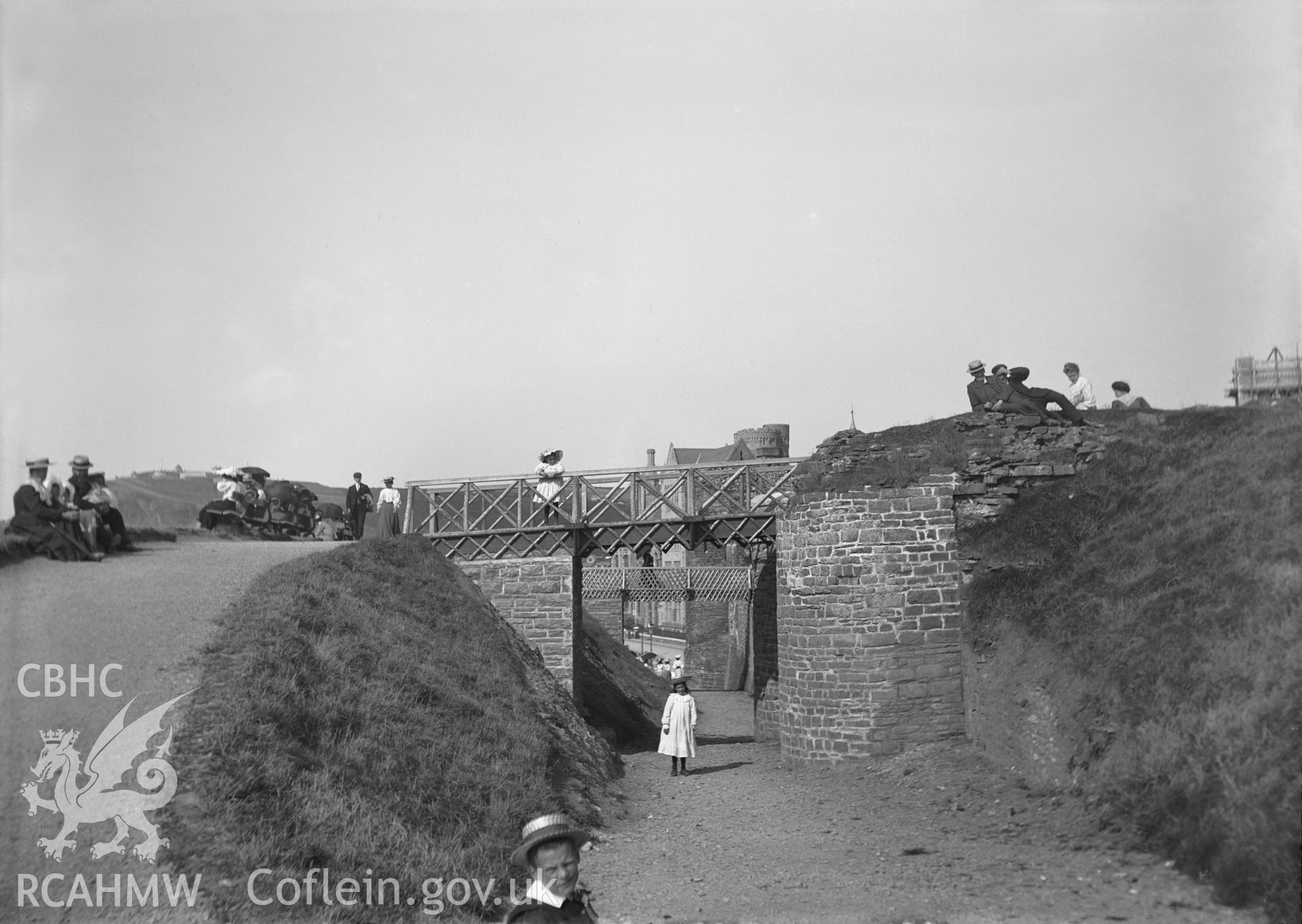Black and white image dating from c.1910 showing the walkway across the moat at Aberystwyth Castle.