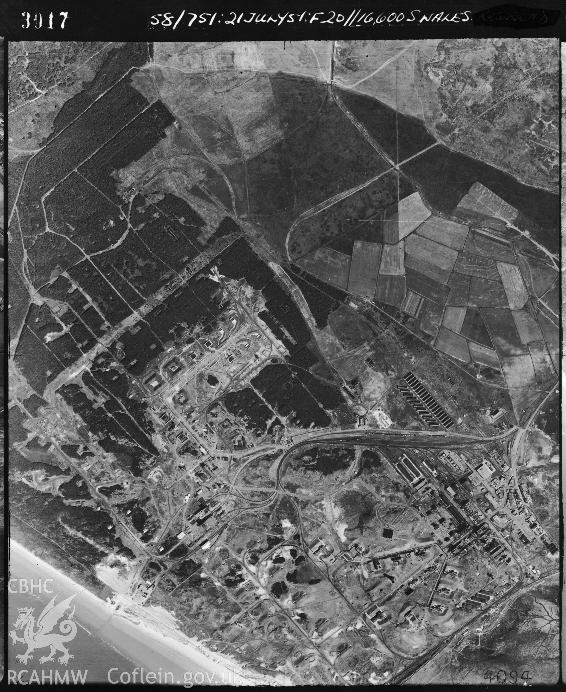 Black and white vertical aerial photograph taken by the RAF on 21/07/1951 centred on SN41230089 at a scale of 1:10000. The photograph includes the Pembrey Dynamite Works, part of Cefn Sidan community in Carmarthenshire.