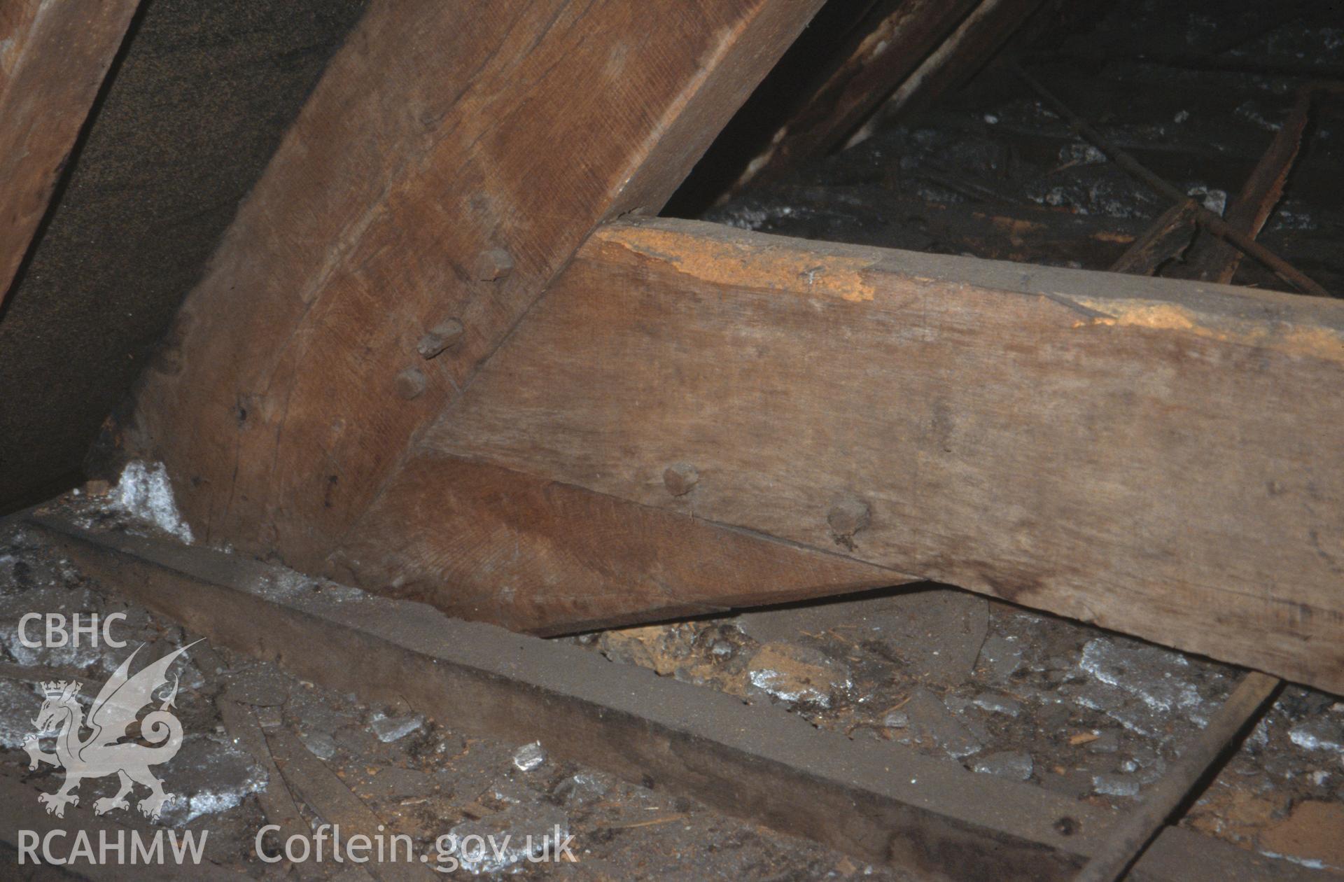 Interior view showing detail of the arched-braced truss in 1666 brick wing.