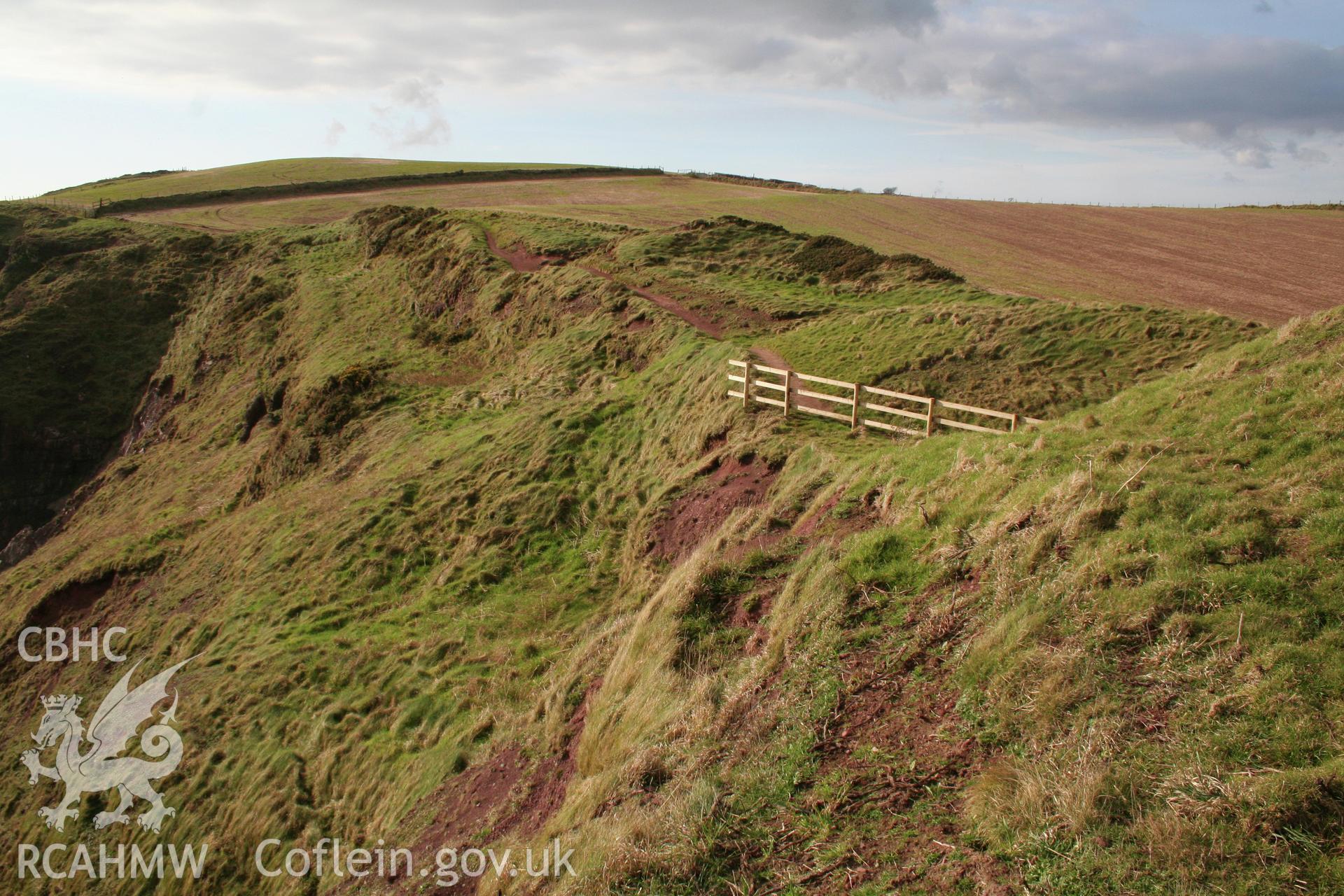 Looking north-west across the ramparts (and their erosion) defining the annexe of the fort.