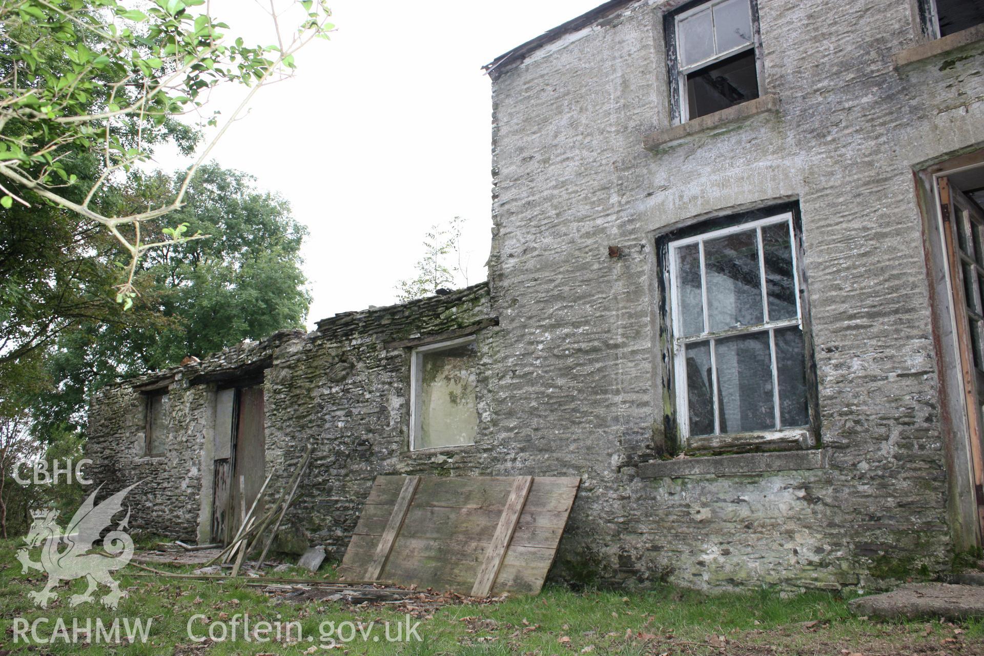 Exterior, view of cottage & stable from south.