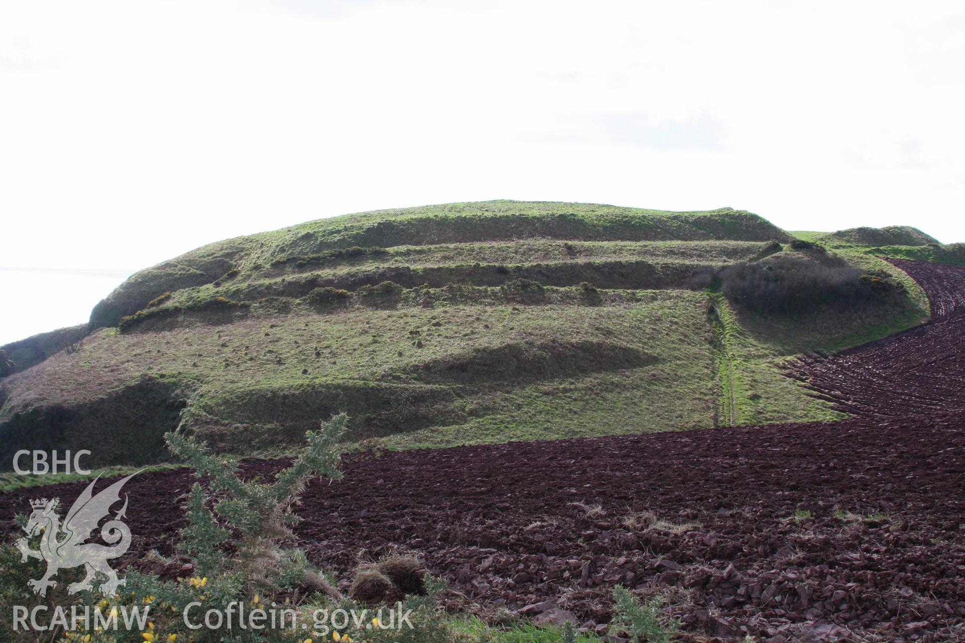 Looking south across the outer enclosure and ramparts on the north side of the fort.  The main fort entrance is on the far left.