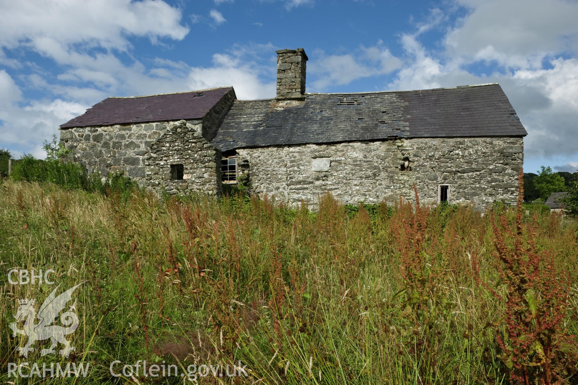 House and cart shed from the southwest.