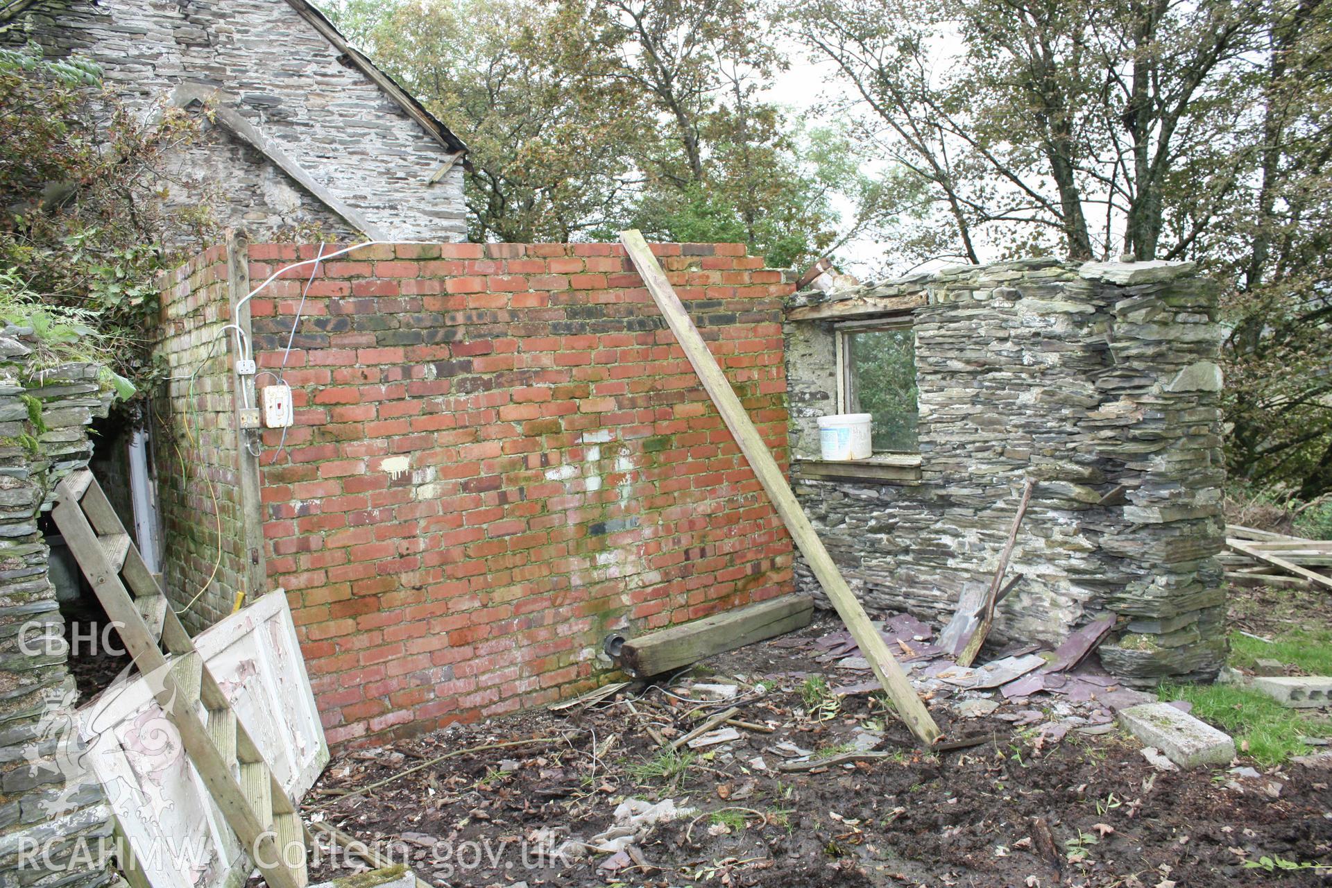 Exterior, view of stable from the west with 20th century brick work.