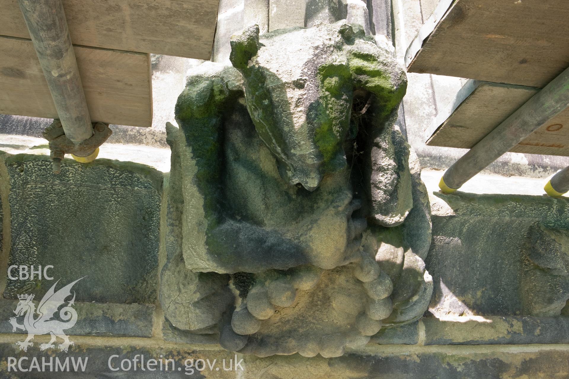 Stone carving below finials, moving clockwise.