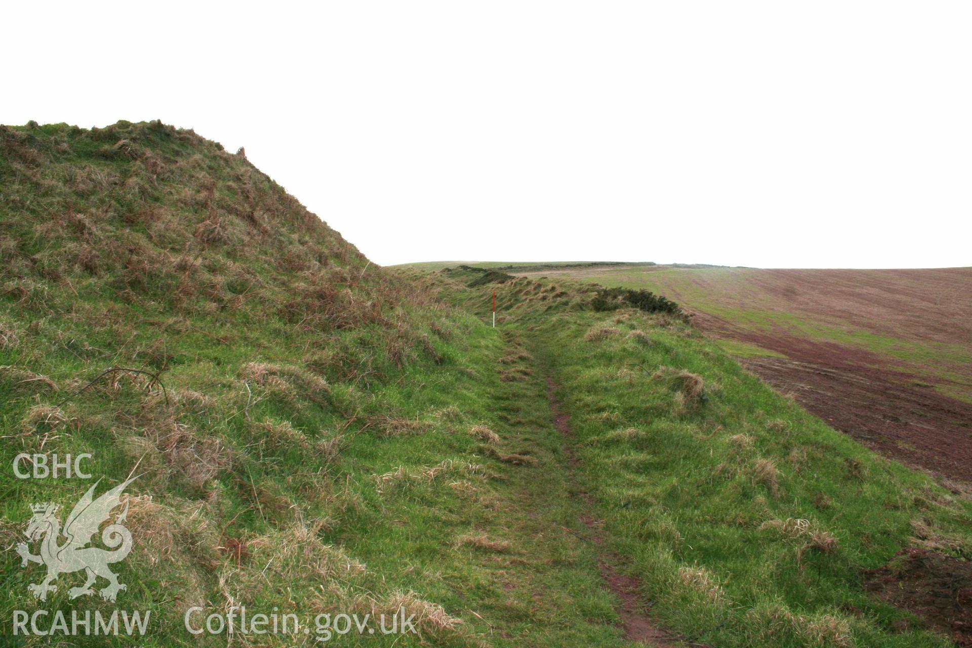 Looking west along the Pembrokeshire Coast Path at the base of the ditch to the inner rampart of teh annexe defences.