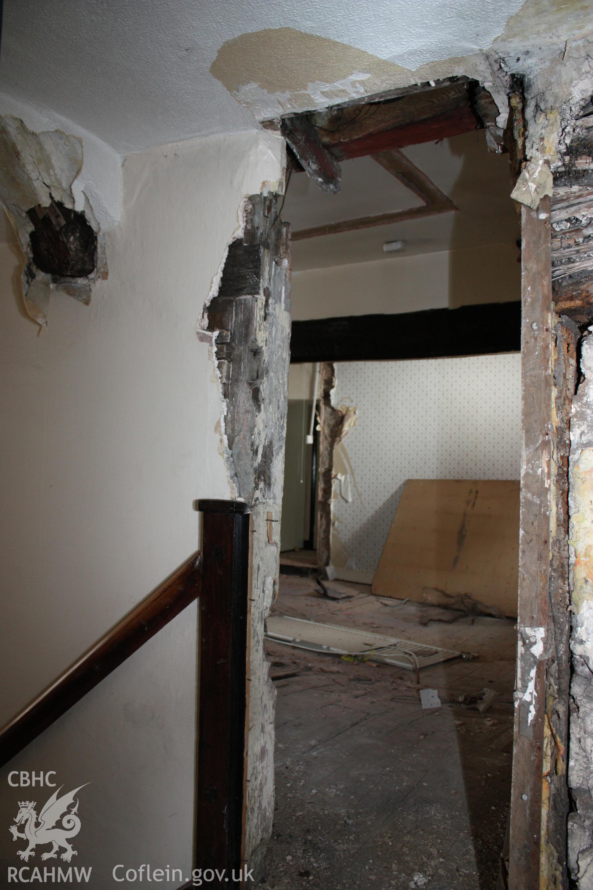51, Clwyd Street, interior, hall wall from stair at first-floor, looking into 17th century rear-wing.