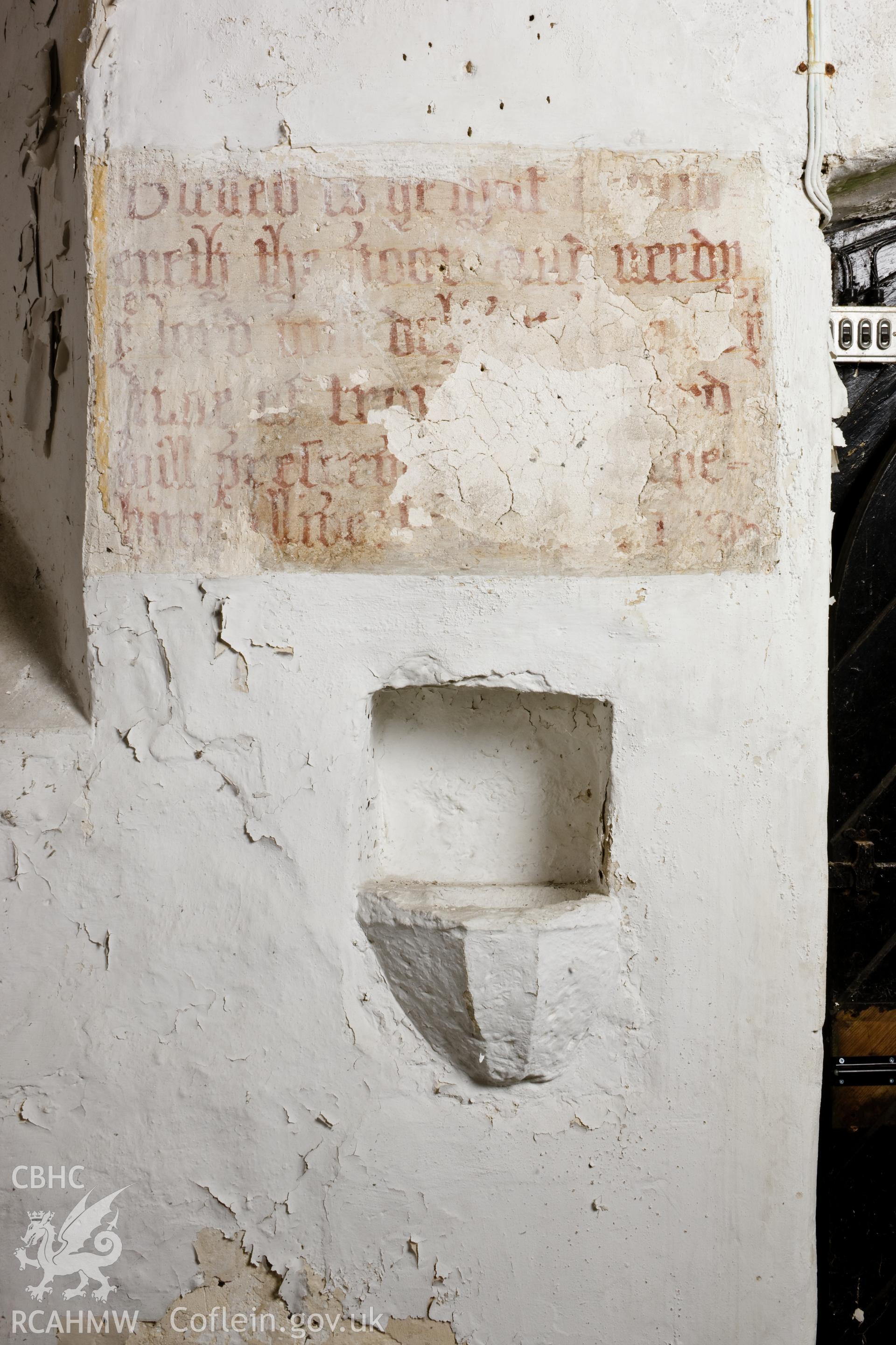 Interior, stoup on south wall.