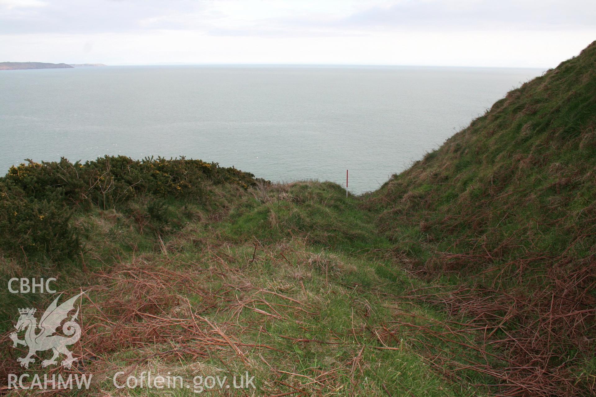 Looking south-east along the section of bank sitting on the terrace between the inner two lines of the defences to the north of the forts interior.