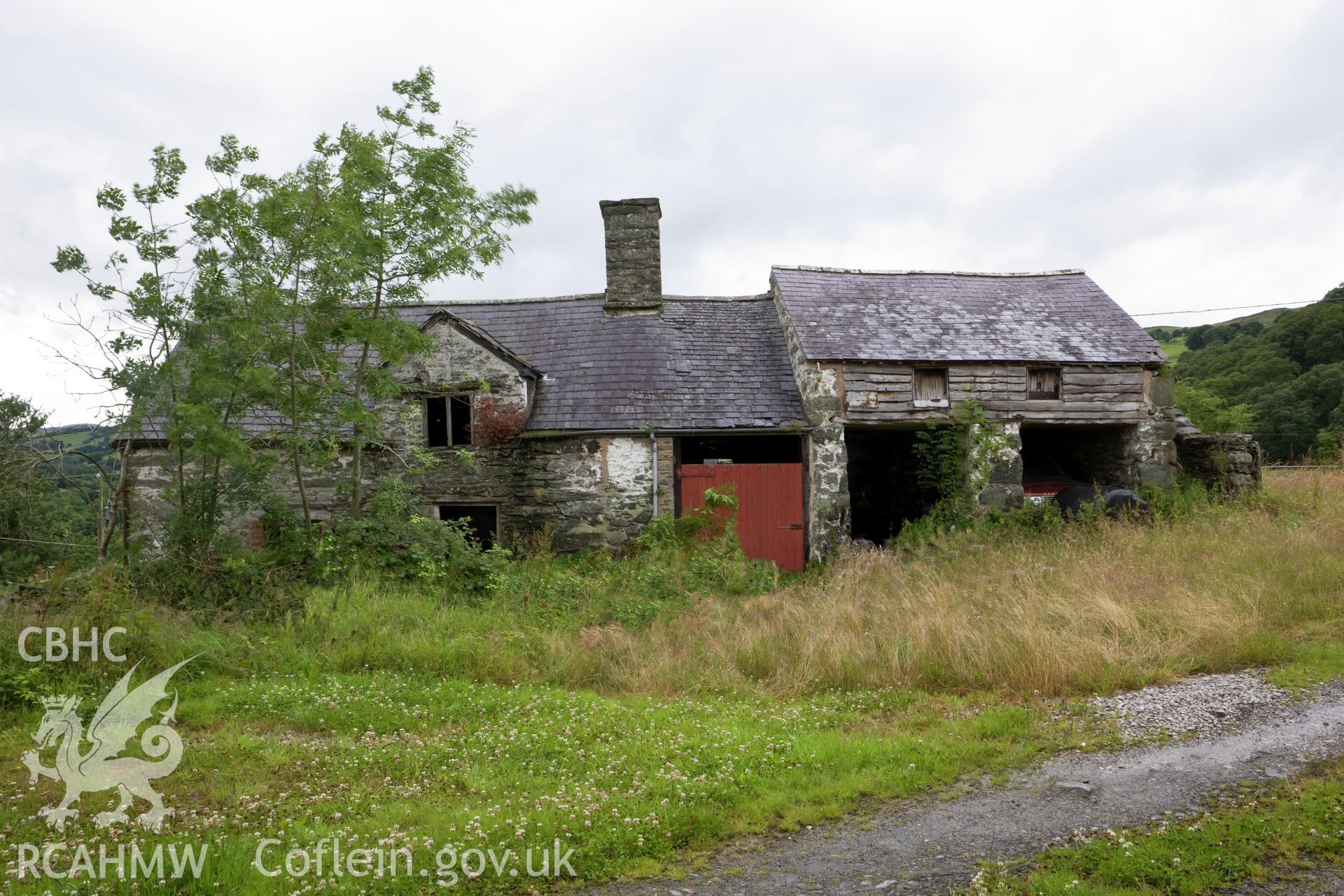 View of house and cart shed from east northeast.